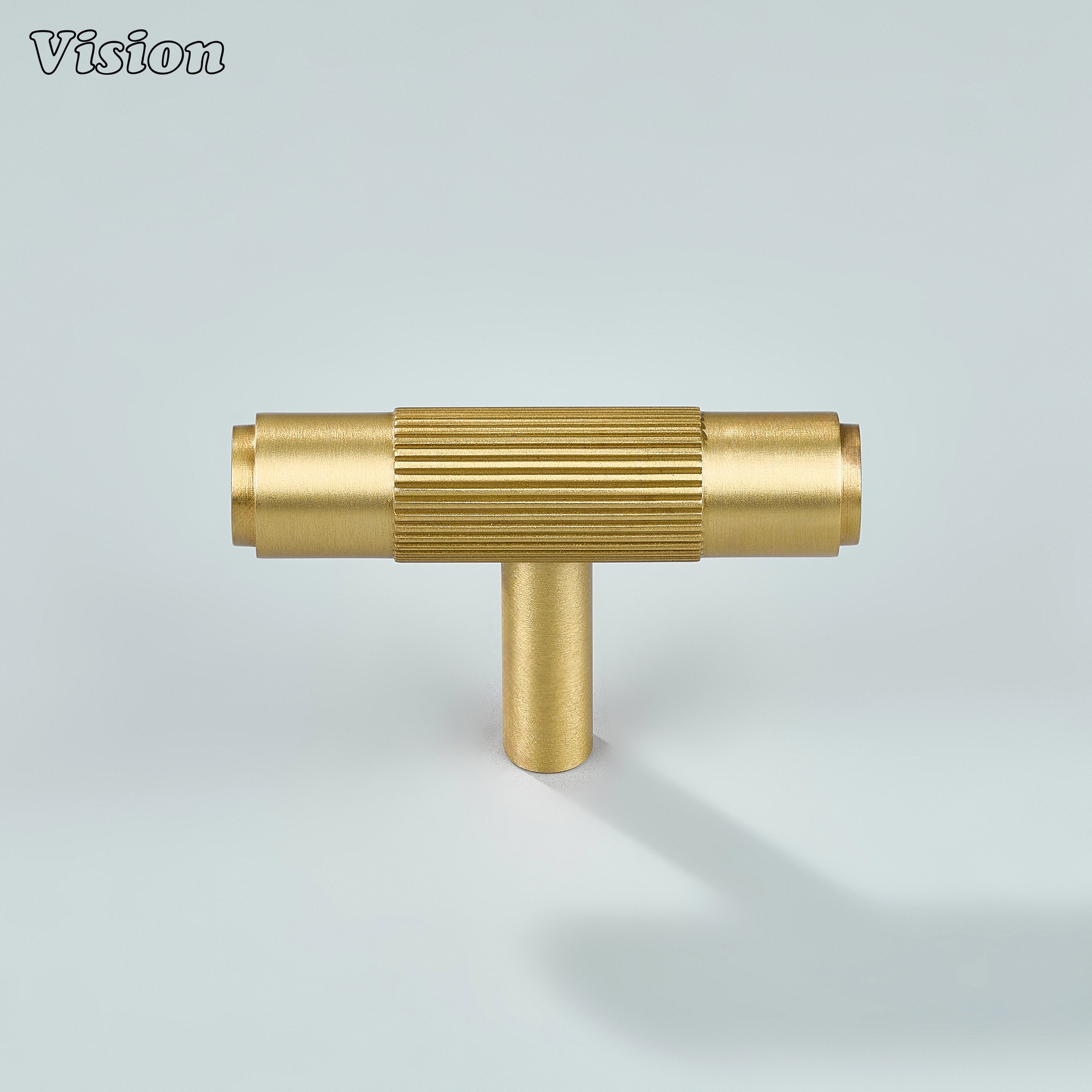 Ignite gold T-knob with fine linear texture for wardrobes.