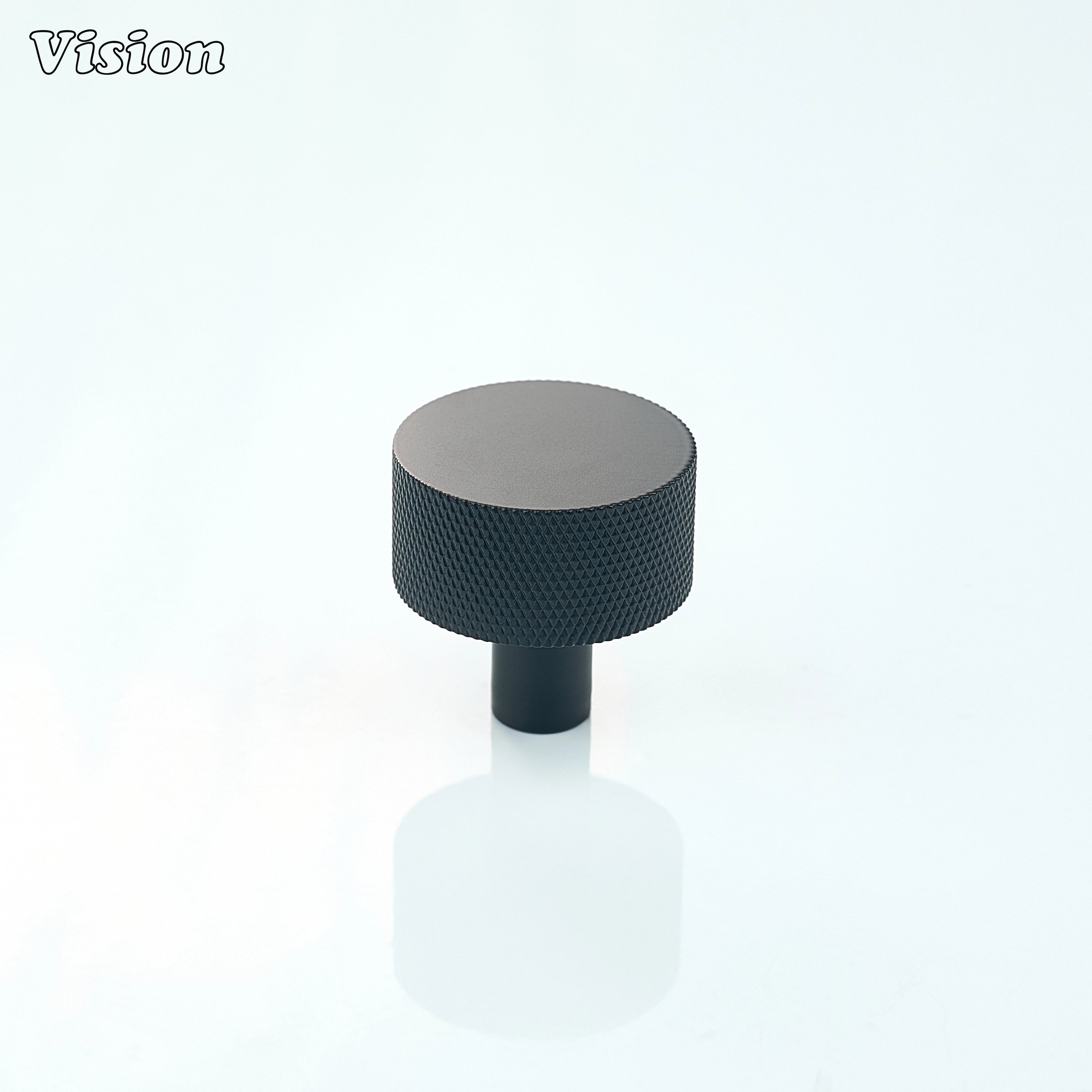 Round Black cabinet knob with grip detailing for wardrobe drawers