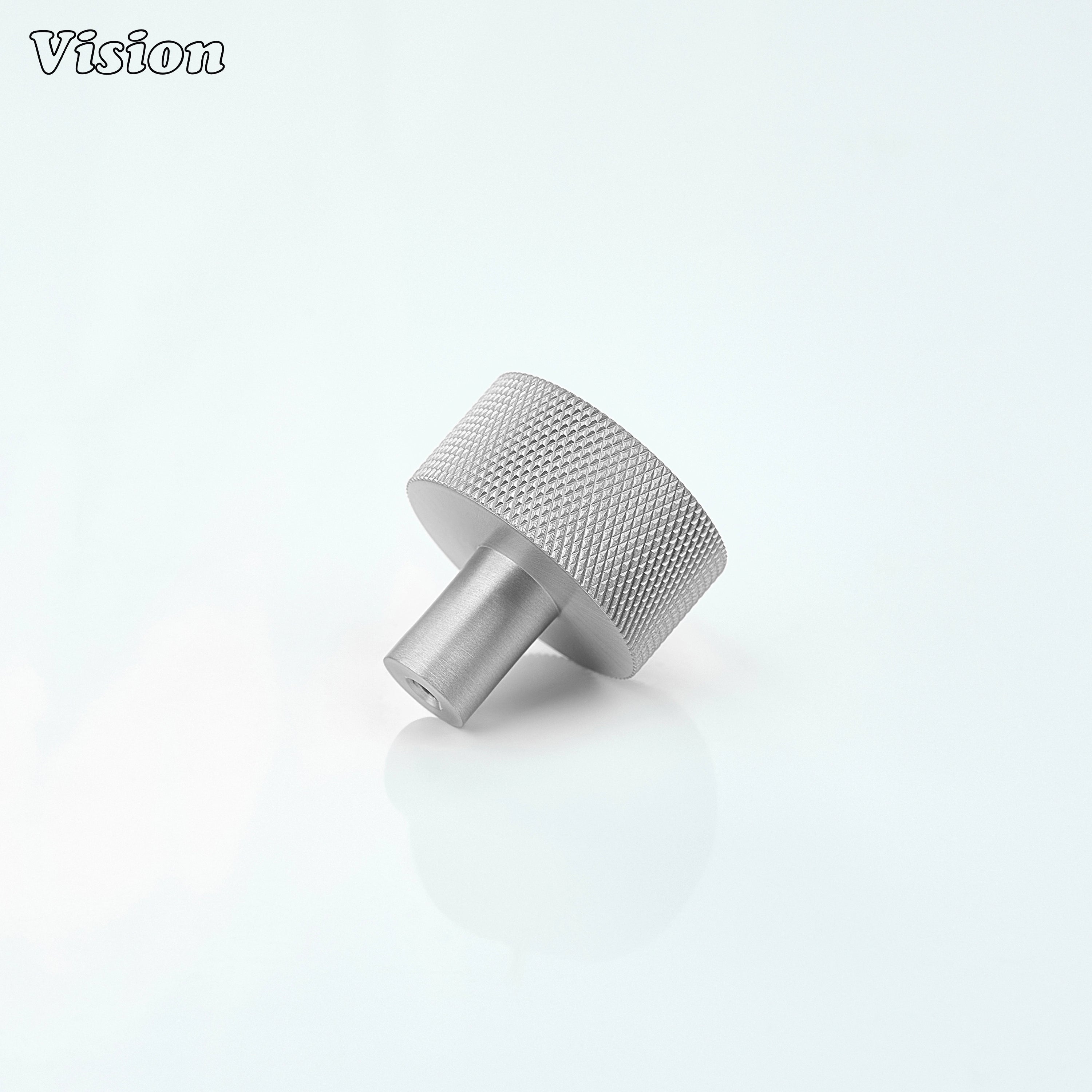 Silver round cabinet knob with textured detail for drawer fronts