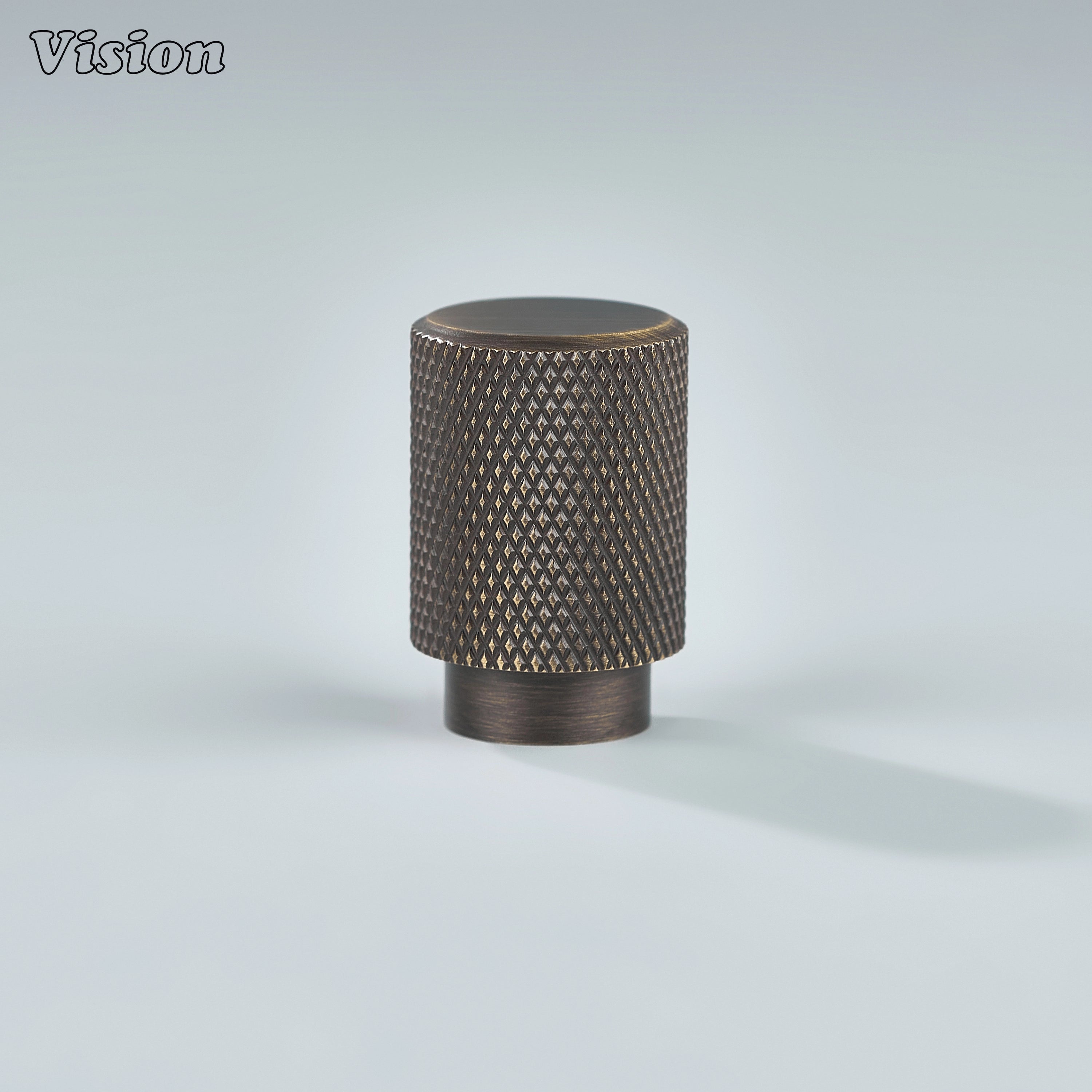 Modern antique bronze knurled cylinder knob used for wardrobe doors.