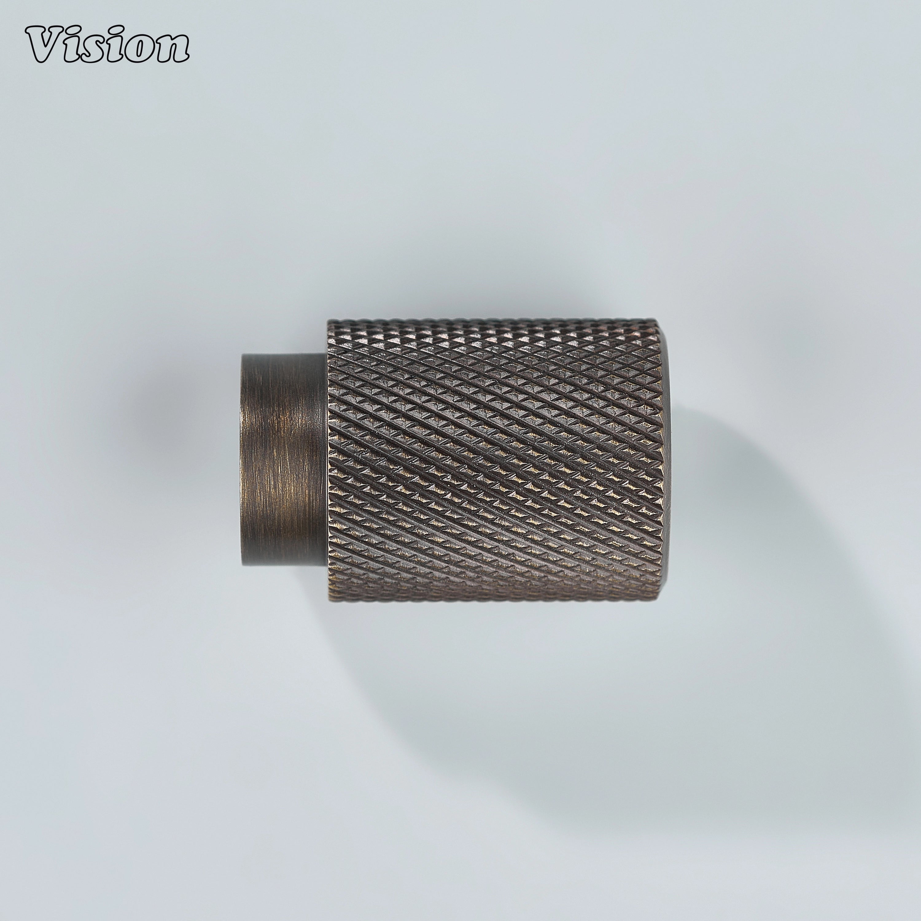 Modern antique bronze knurled cylinder knob used for cupboards.