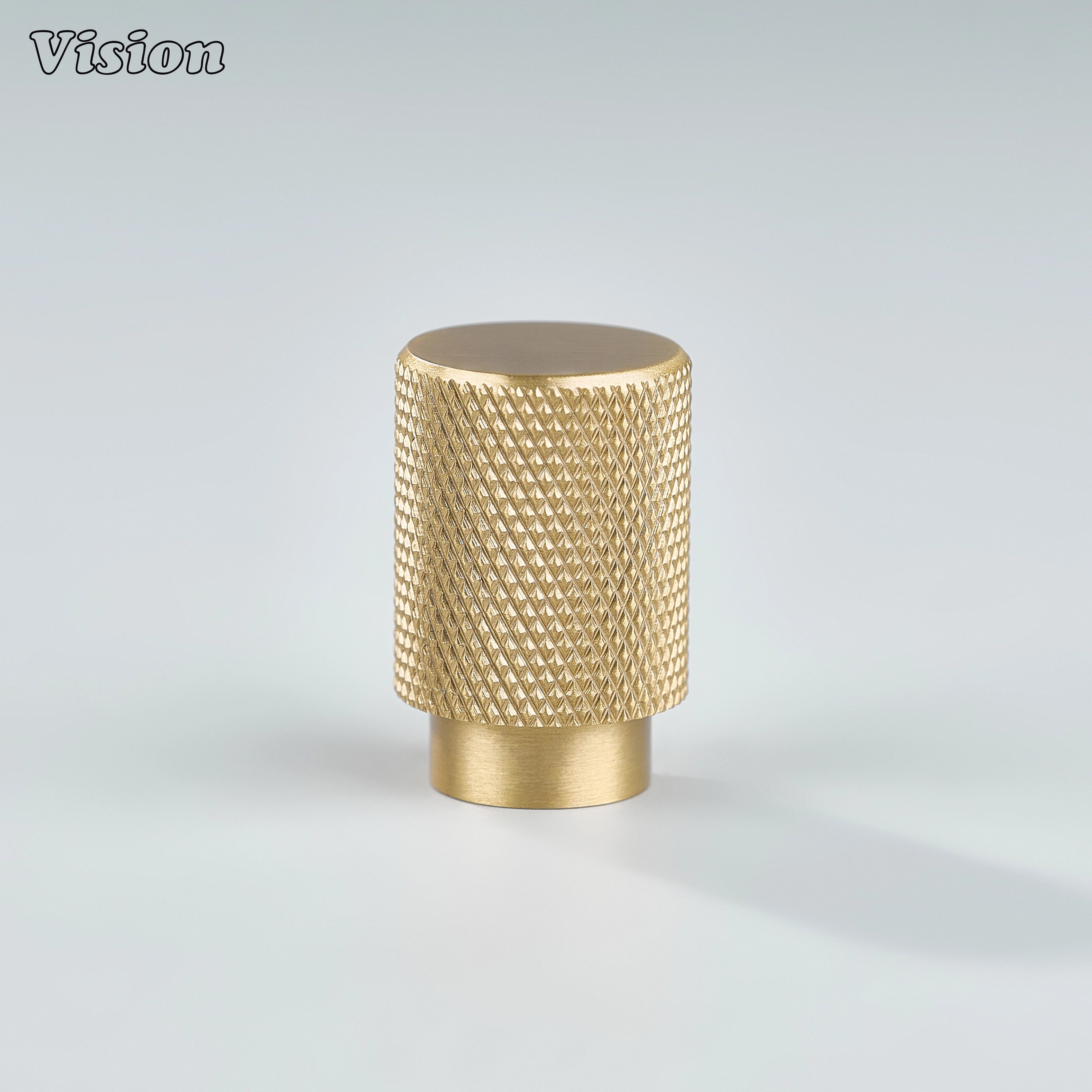 Modern gold knurled cylinder knob used for wardrobe doors.