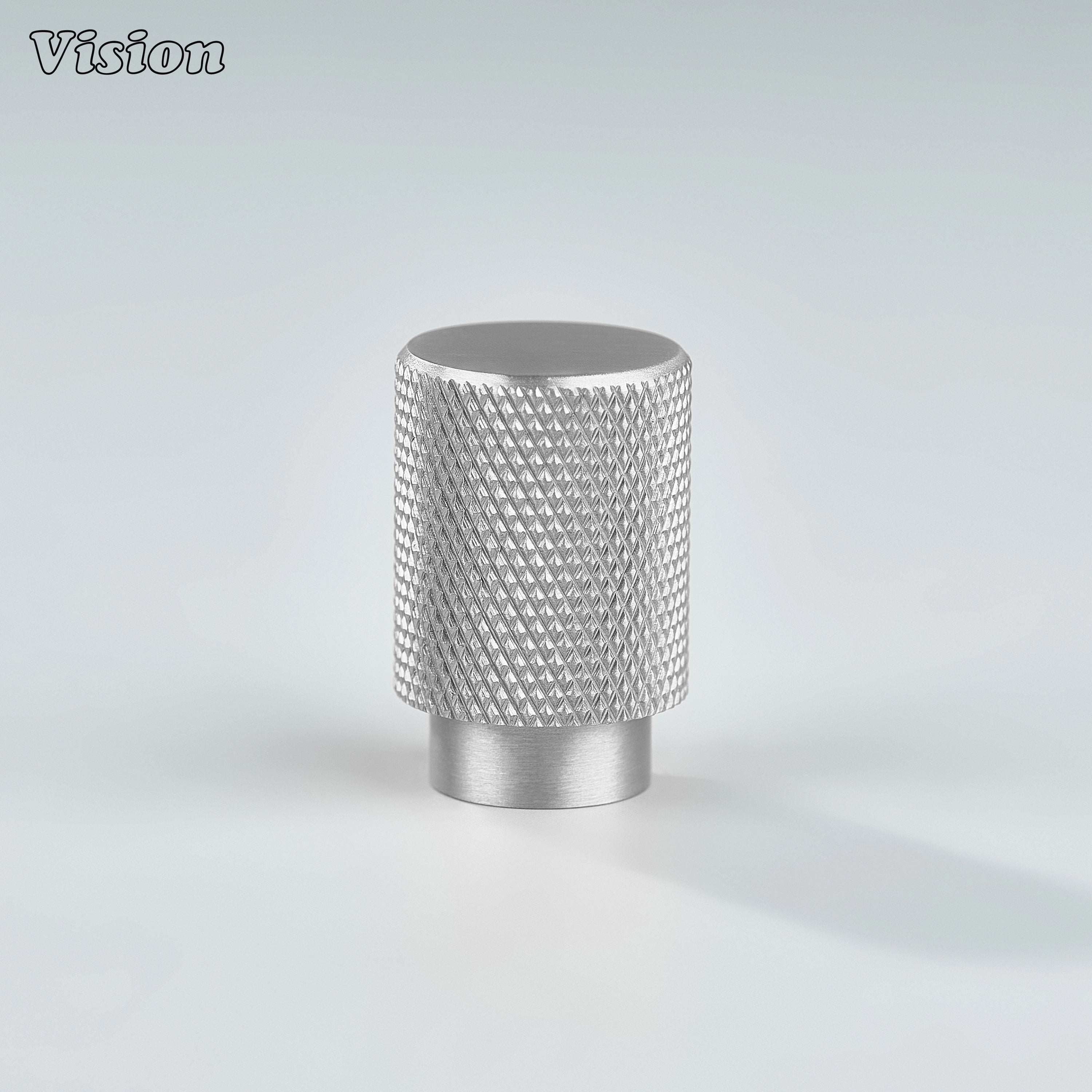 Modern silver knurled cylinder knob used for wardrobe doors.