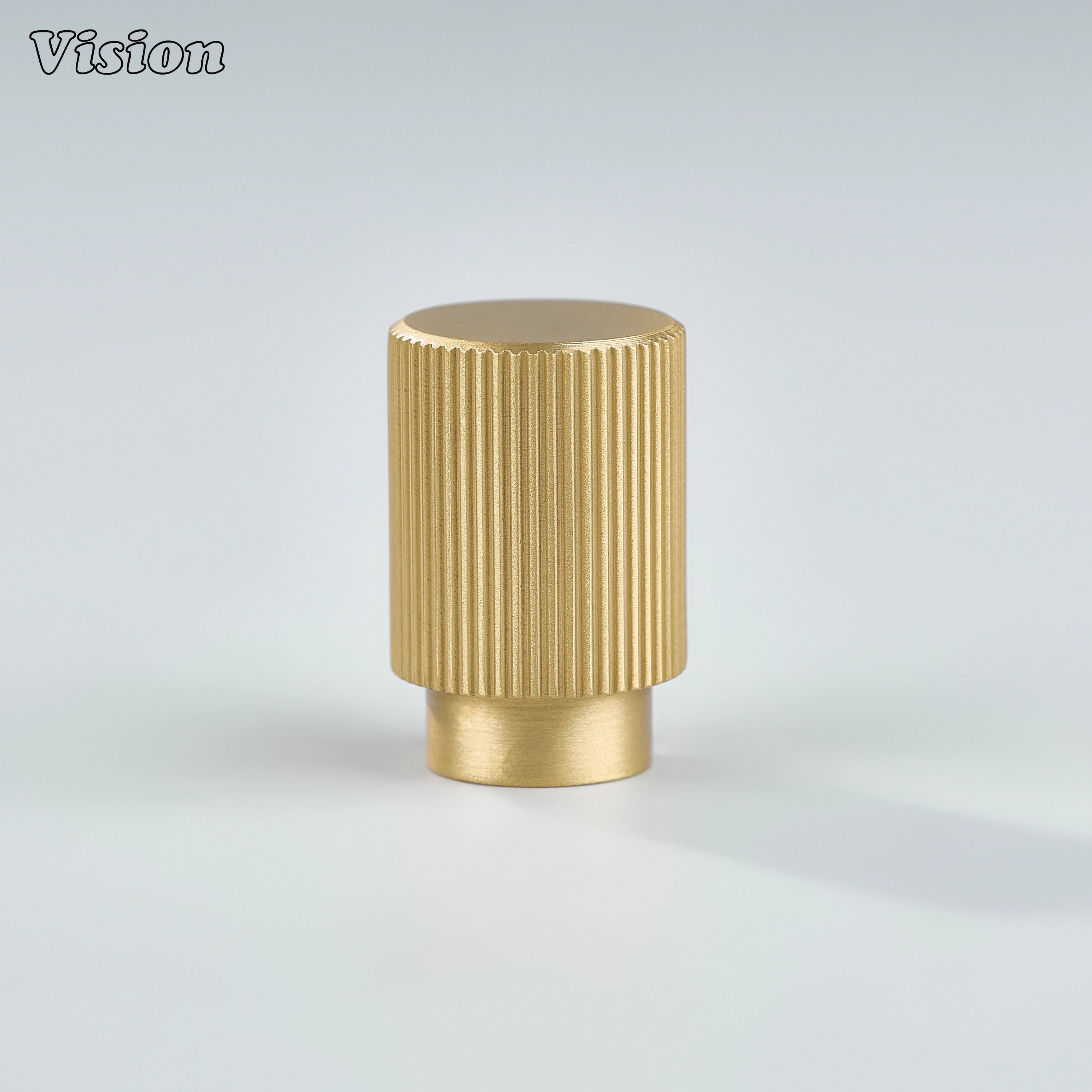 Linear knurled gold cabinet knob featuring cylindrical form for wardrobe doors