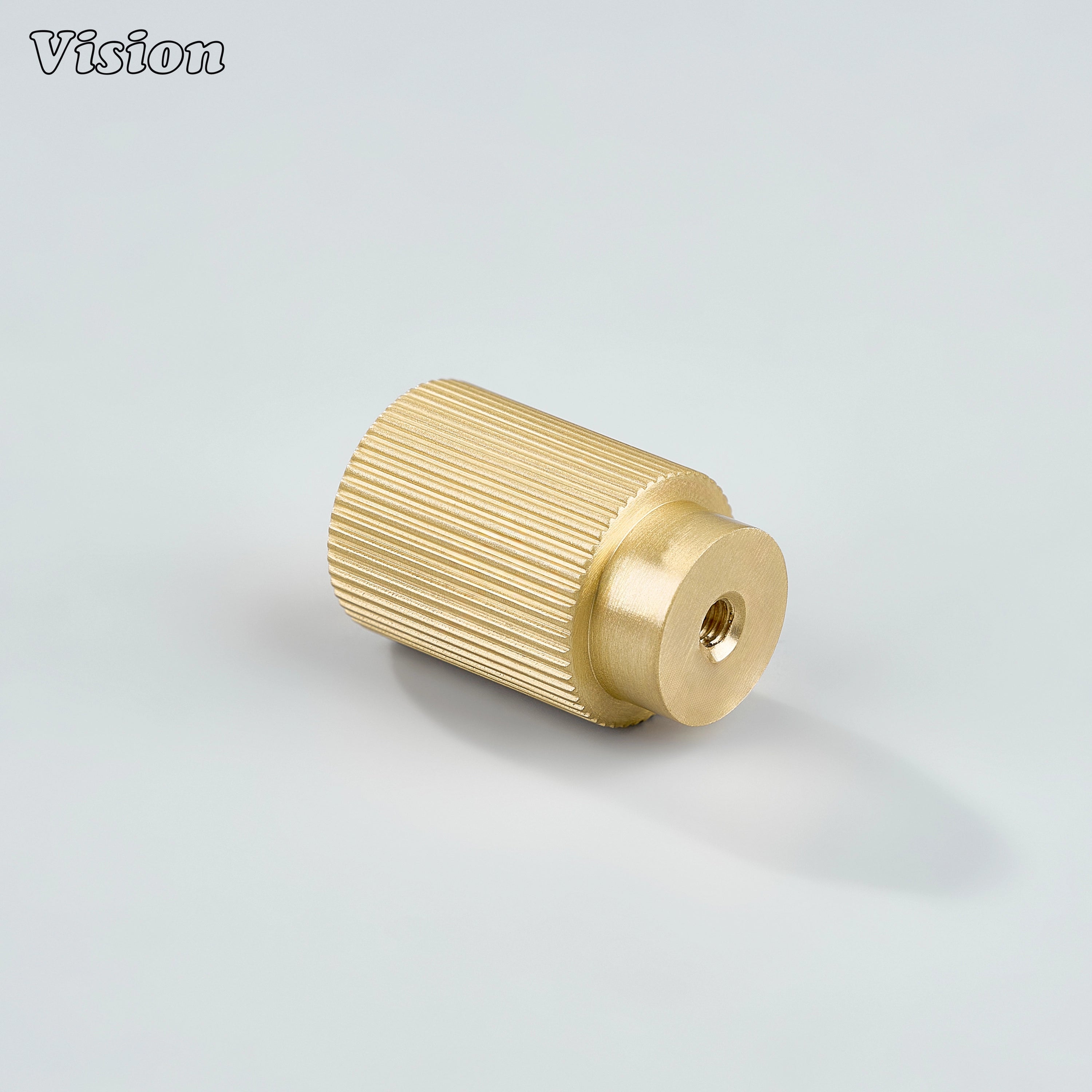 Gold finished brass cylinder cabinet knob with textured grip for drawer fronts
