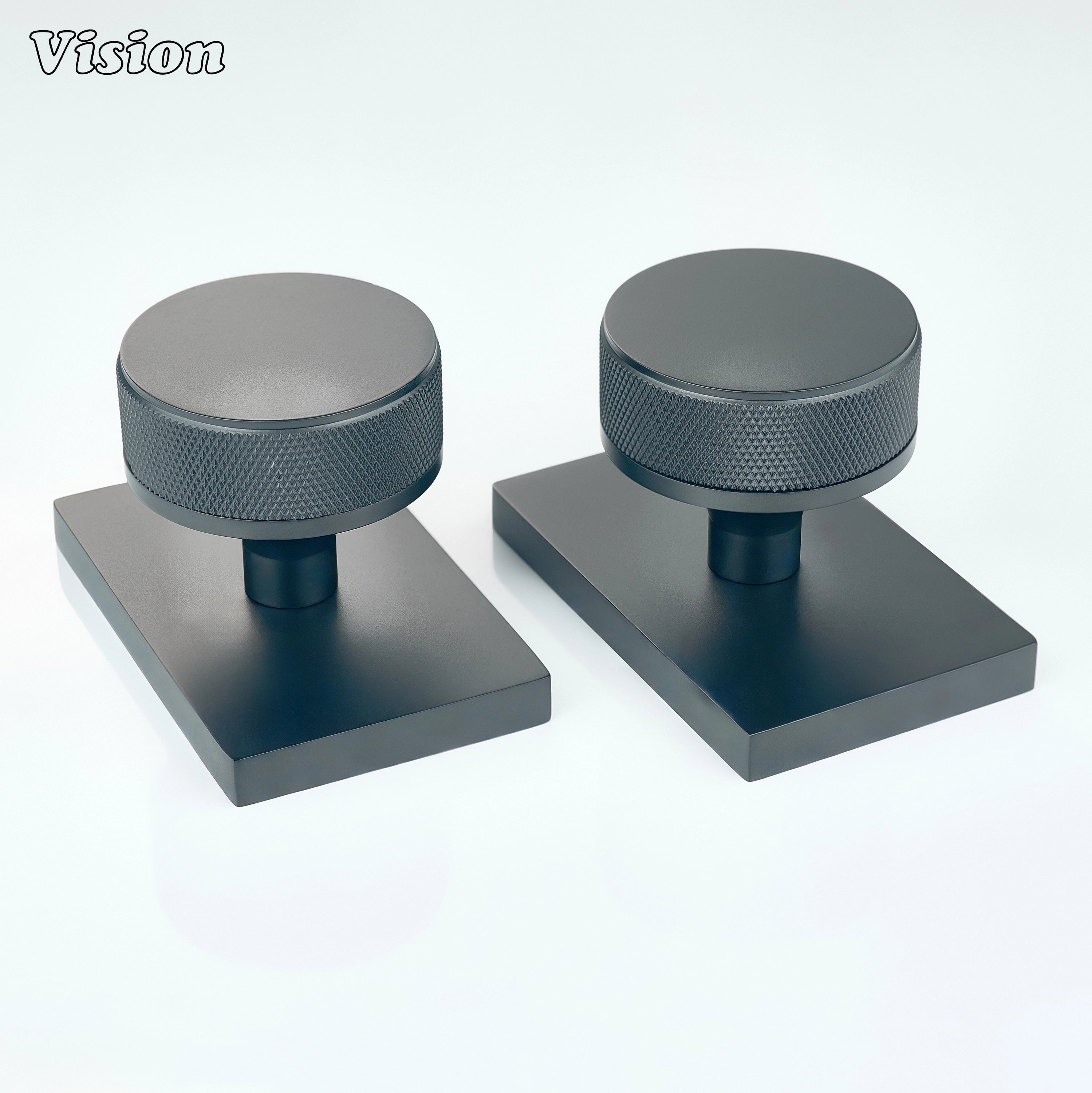 Black round knurled door knob with square base for industrial door spaces