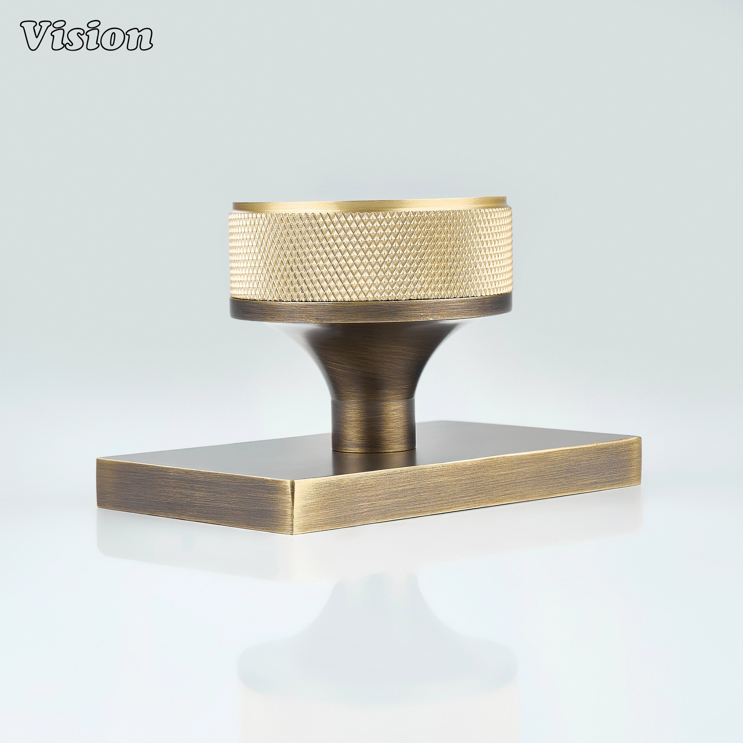 Gold and Antique Bronze door knob with knurled grip and rectangular conceal plate