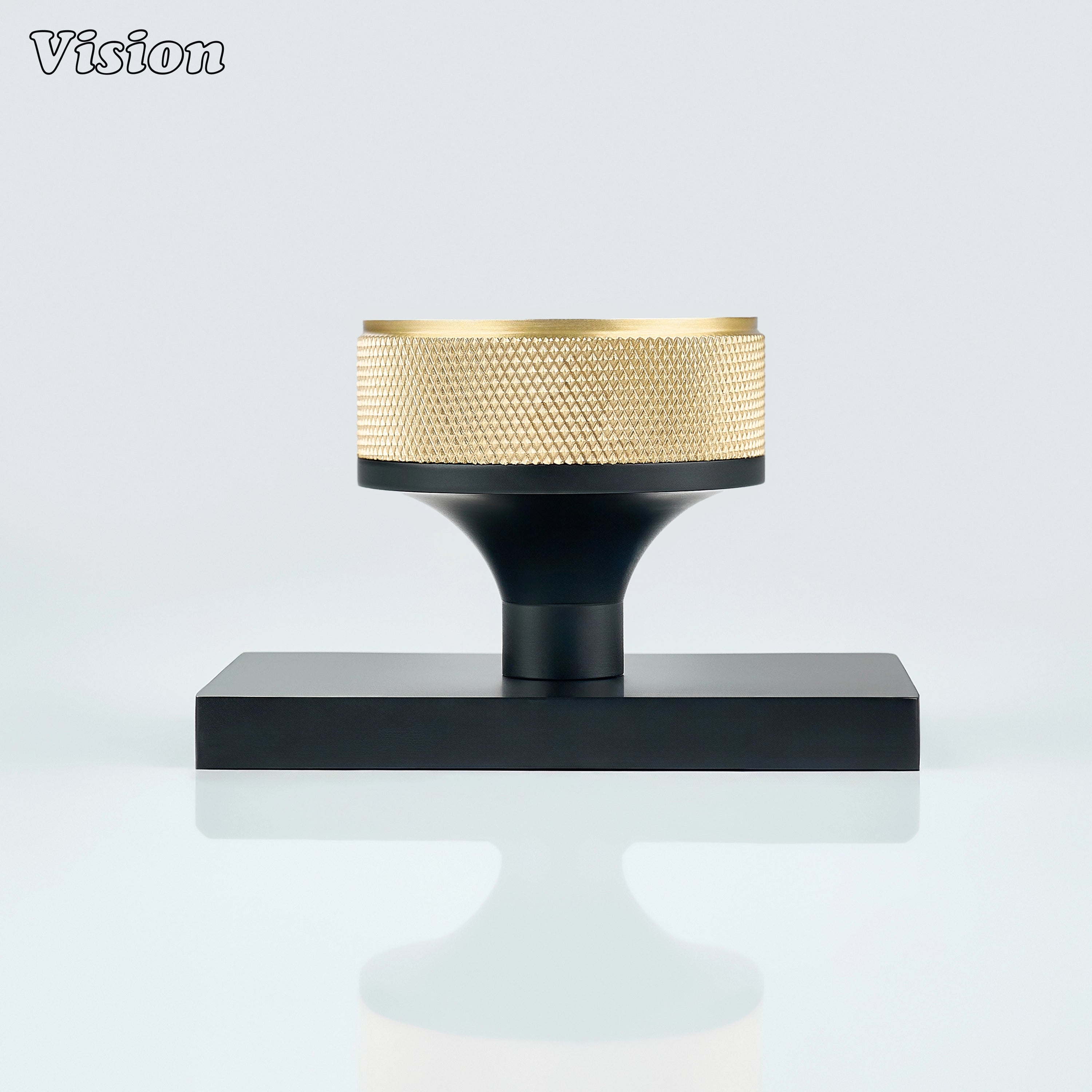 Gold and Black door knob with knurled grip and black conceal plate