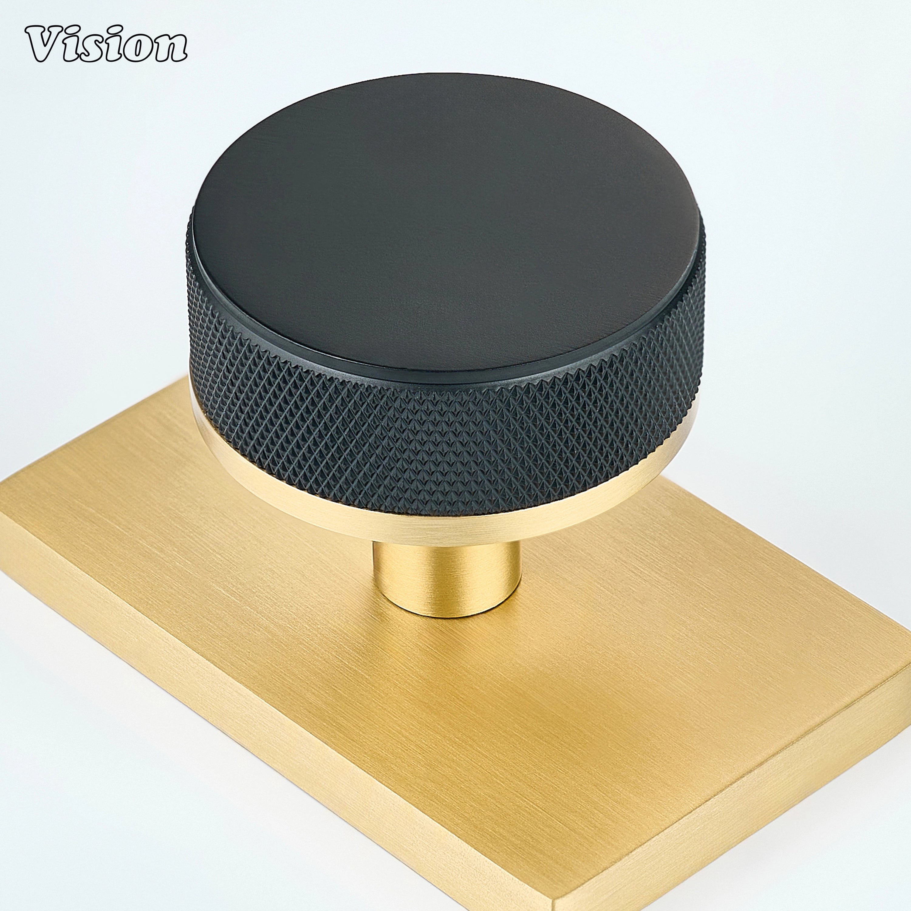 Black and Gold solid brass door knob with contrasting rectangular backplate