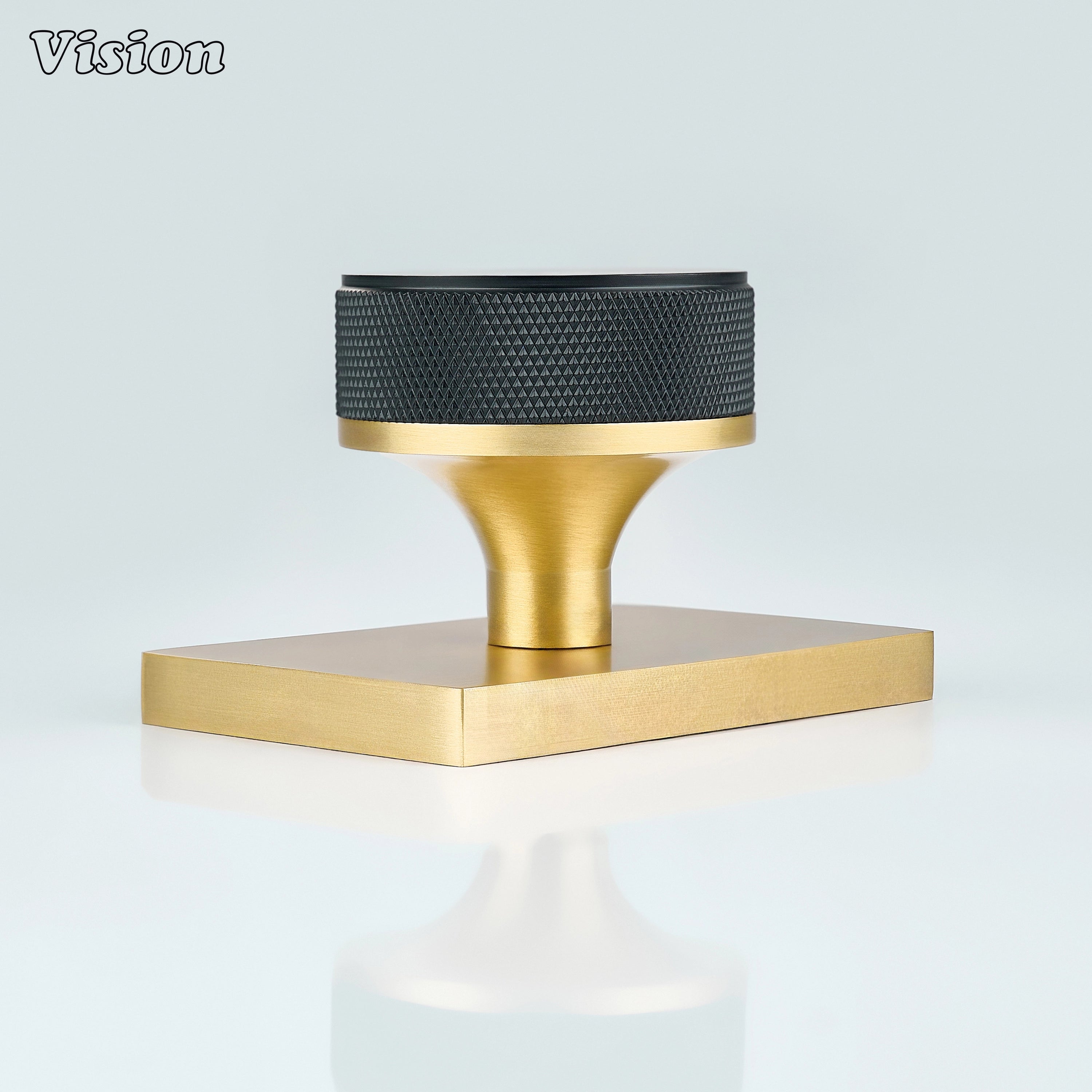 Black and Gold door knob with knurled grip and gold conceal plate