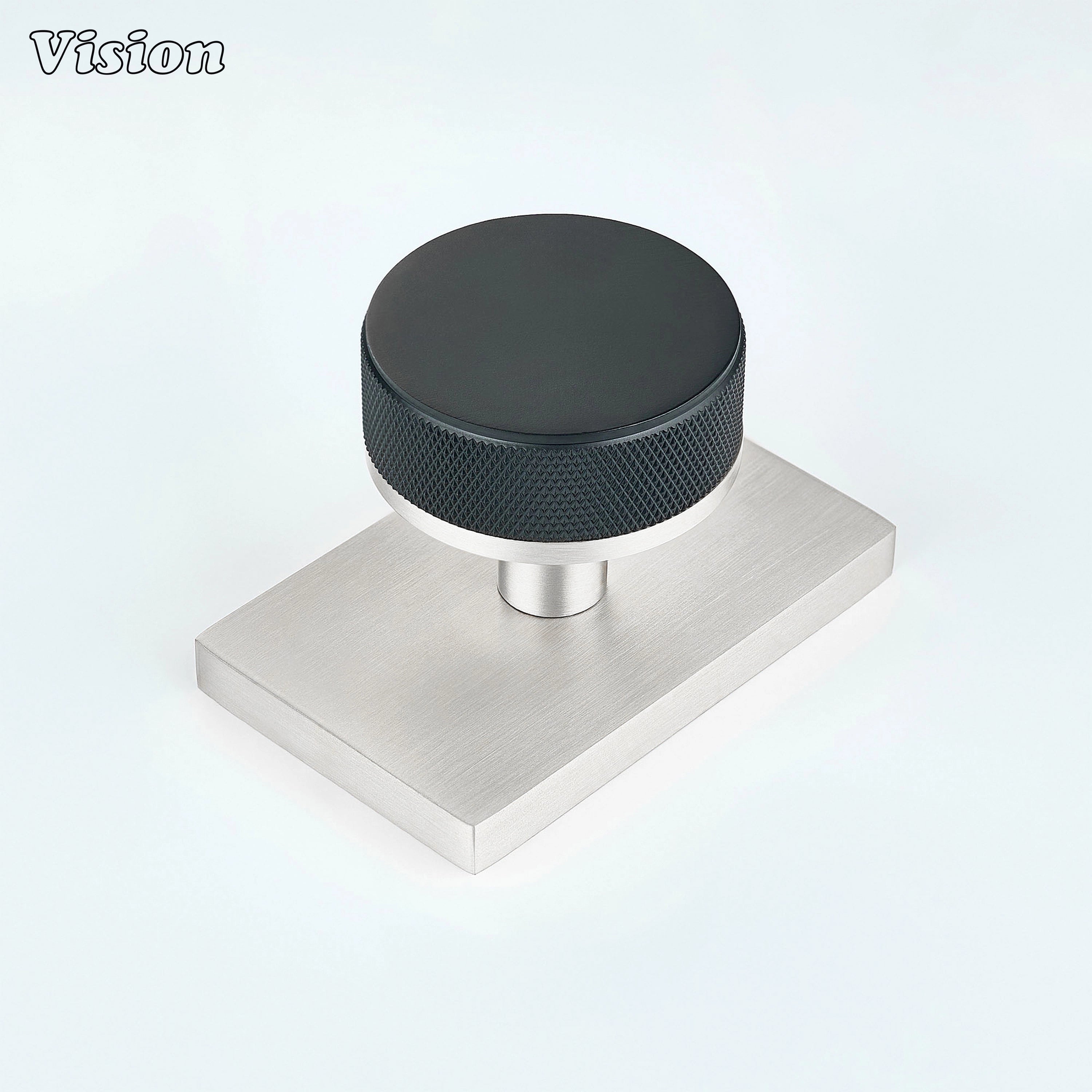 Black and Silver knurled round door knob with black knob and silver rectangular backplate