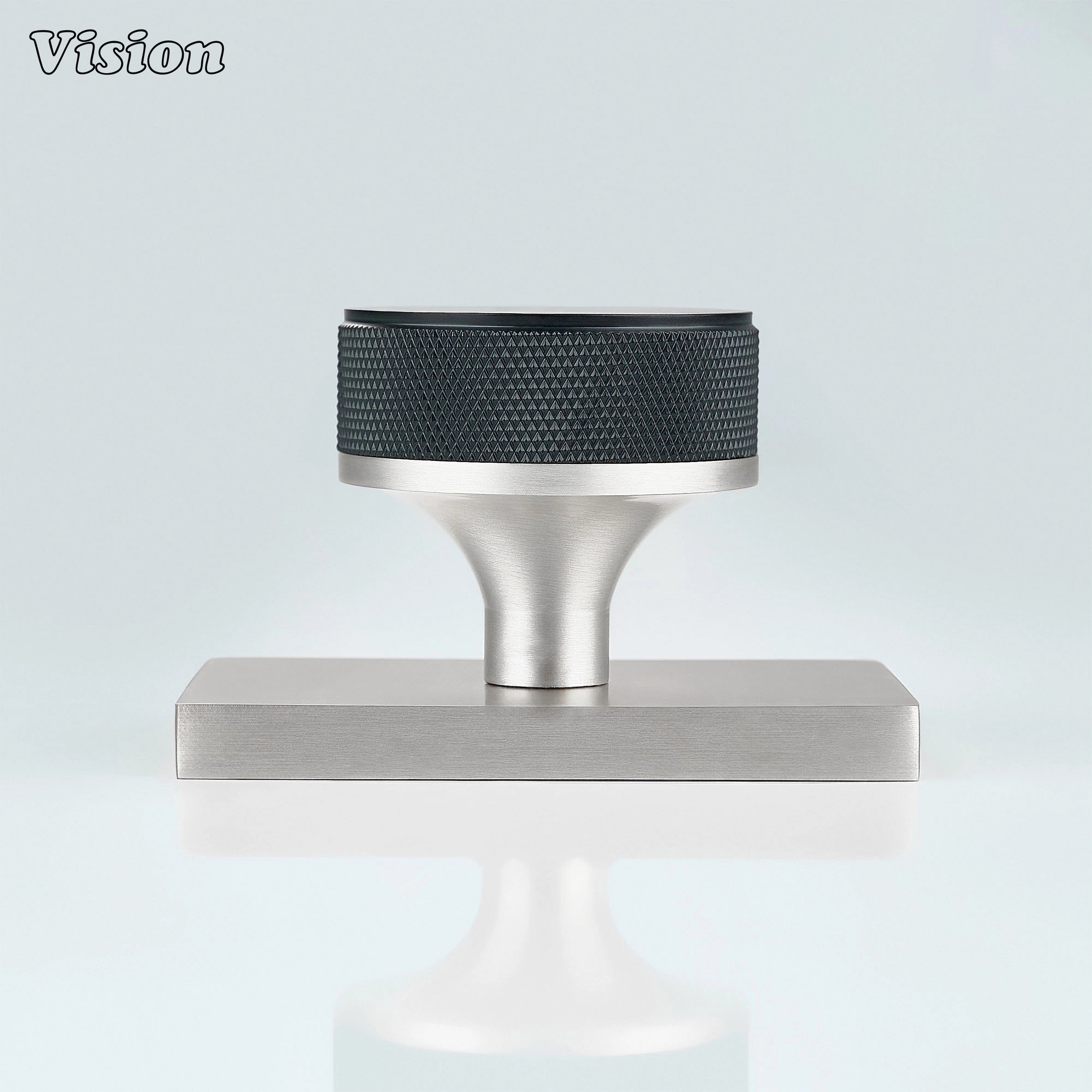 Black and Silver door knob with knurled grip and silver conceal plate