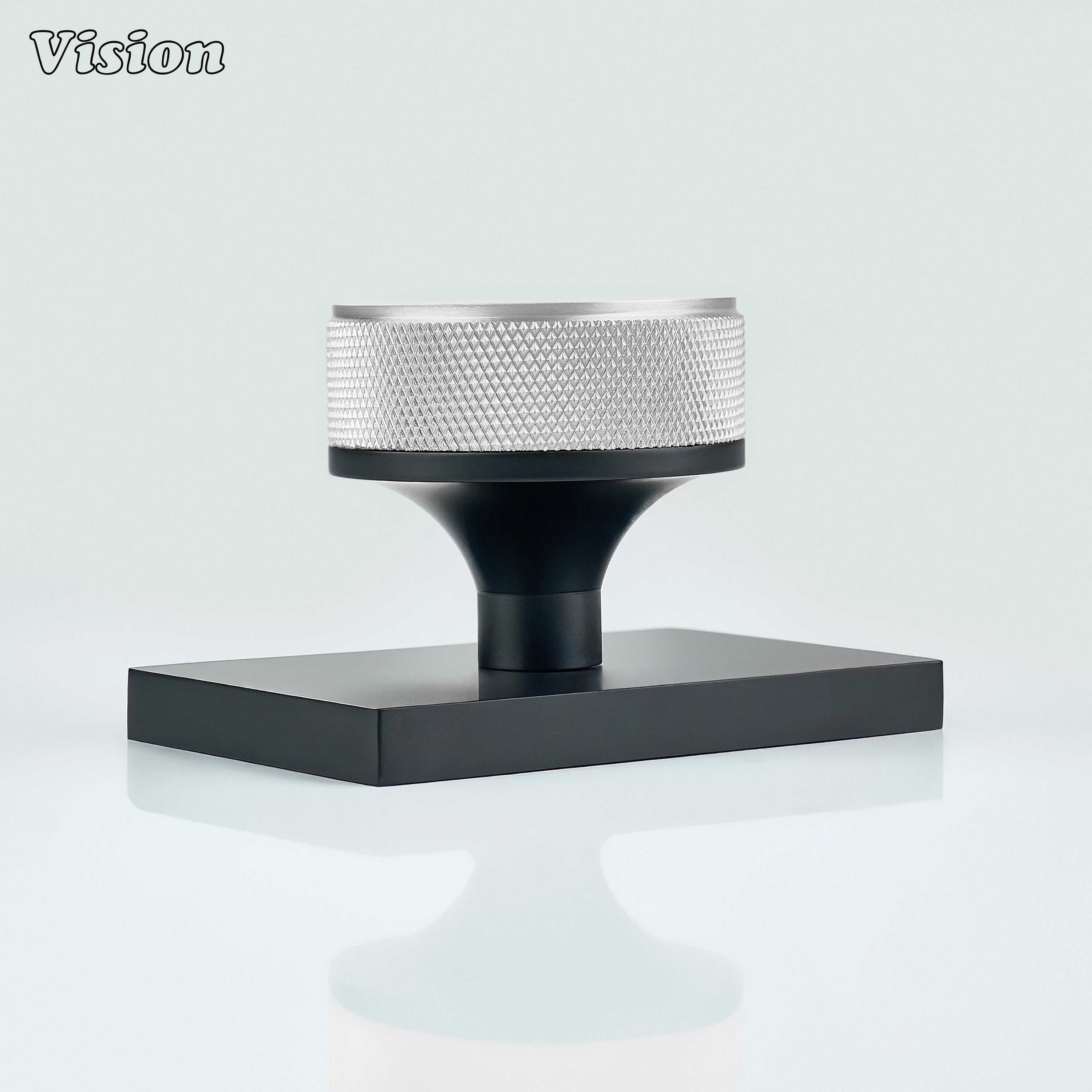 Silver and Black door knob with knurled grip and black conceal plate