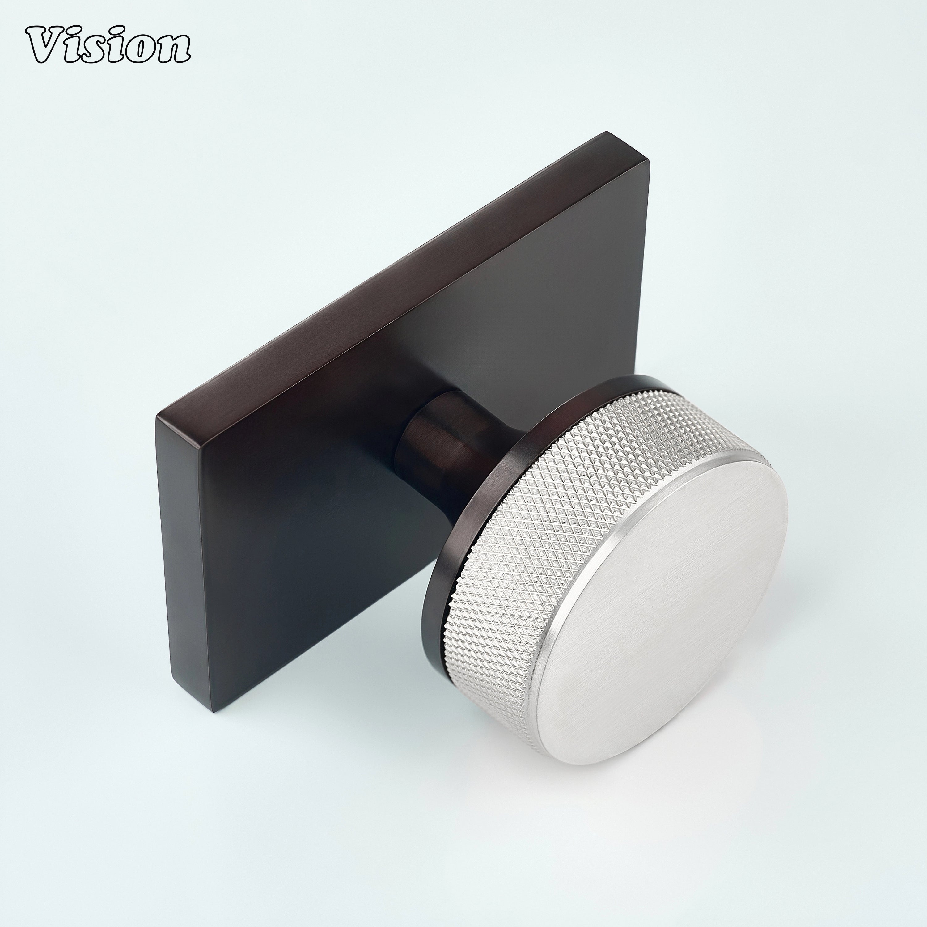 Silver and Oil Rubbed Bronze door knob with knurled grip and bronze conceal plate