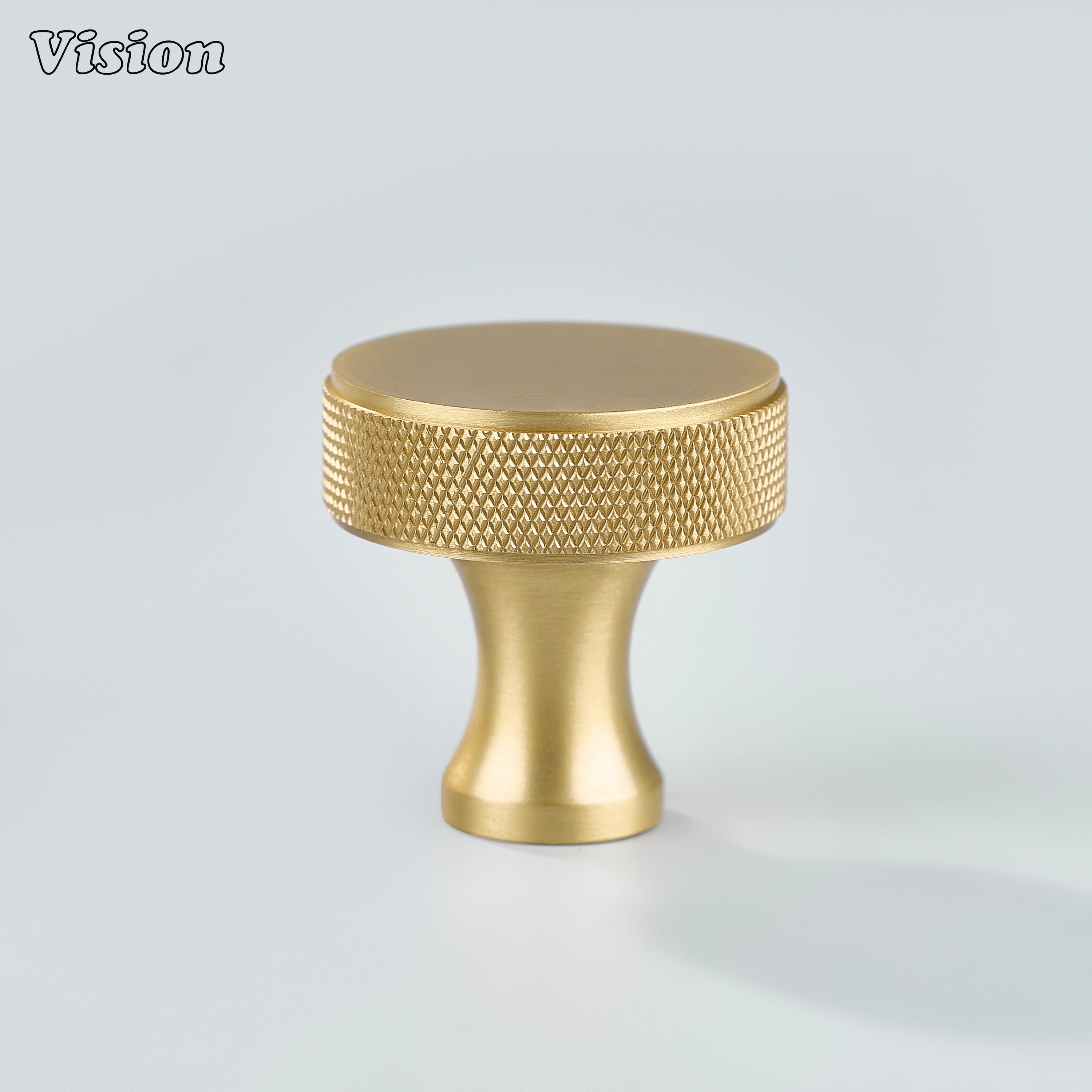 Gold knurled cabinet knob featuring a round brass face and grip detail, ideal for wardrobe doors and drawers