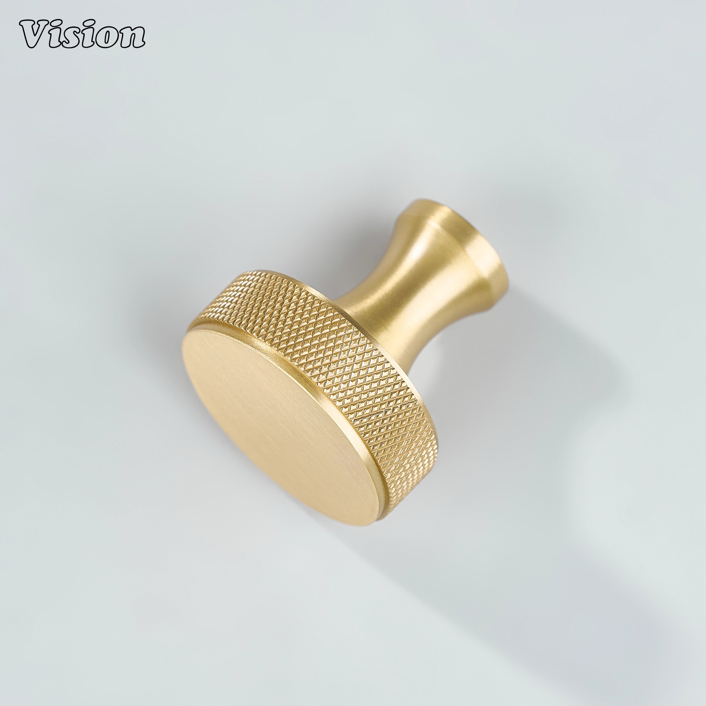 Knurled Gold cabinet knob with smooth round front and textured edge, ideal for living room furniture