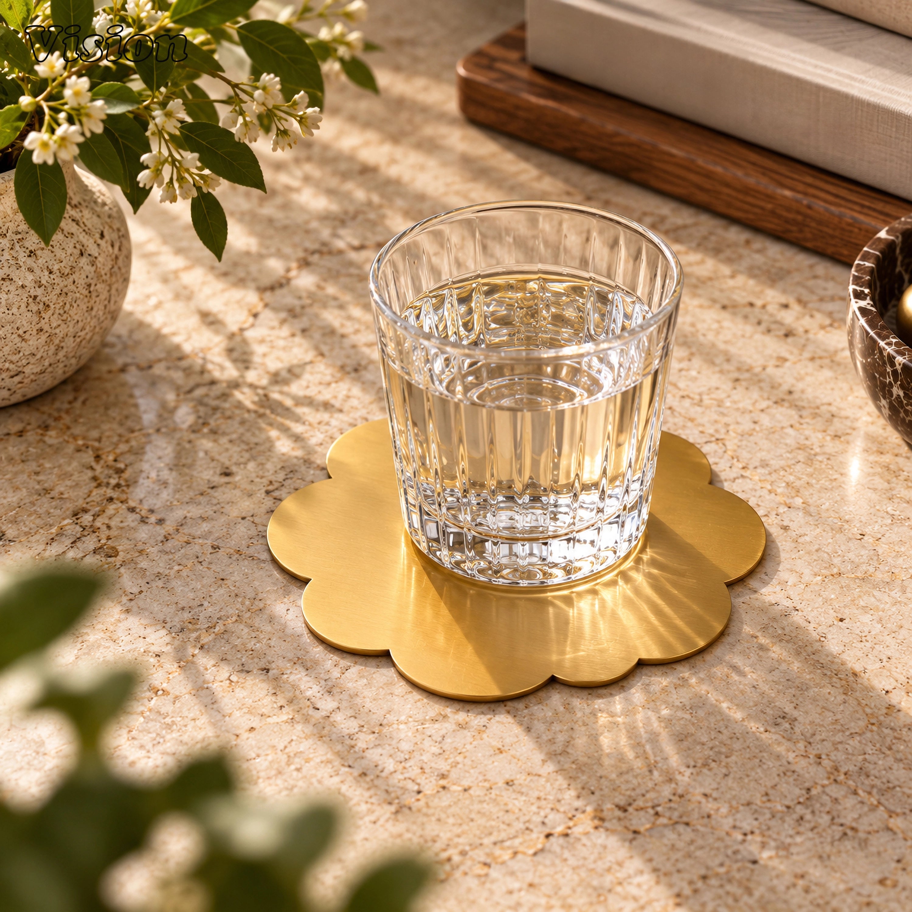 Scalloped gold tabletop coaster featuring a sleek botanical silhouette on a luxury wooden bar cart