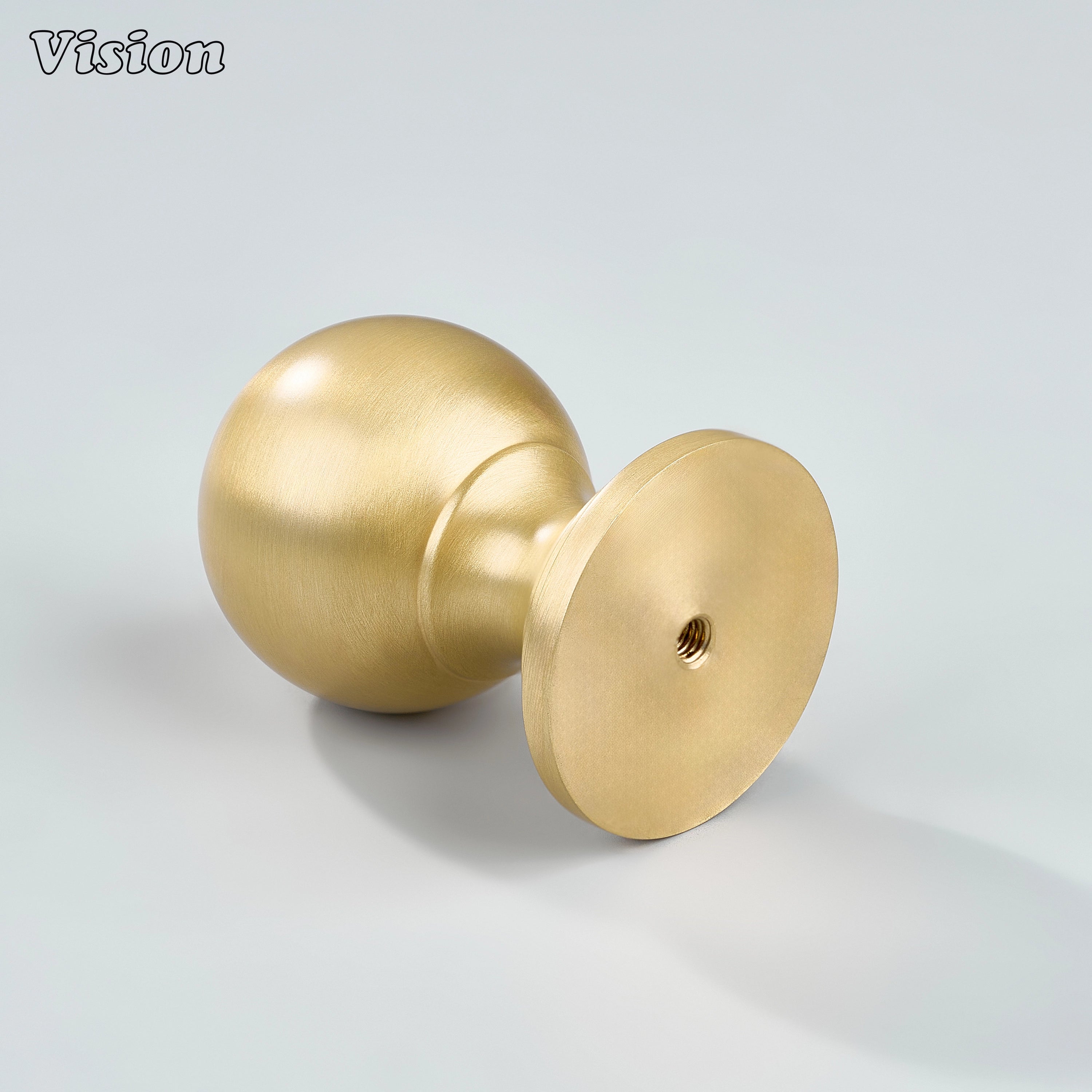 Gold cabinet knob featuring smooth round ball and wide base for furniture drawers