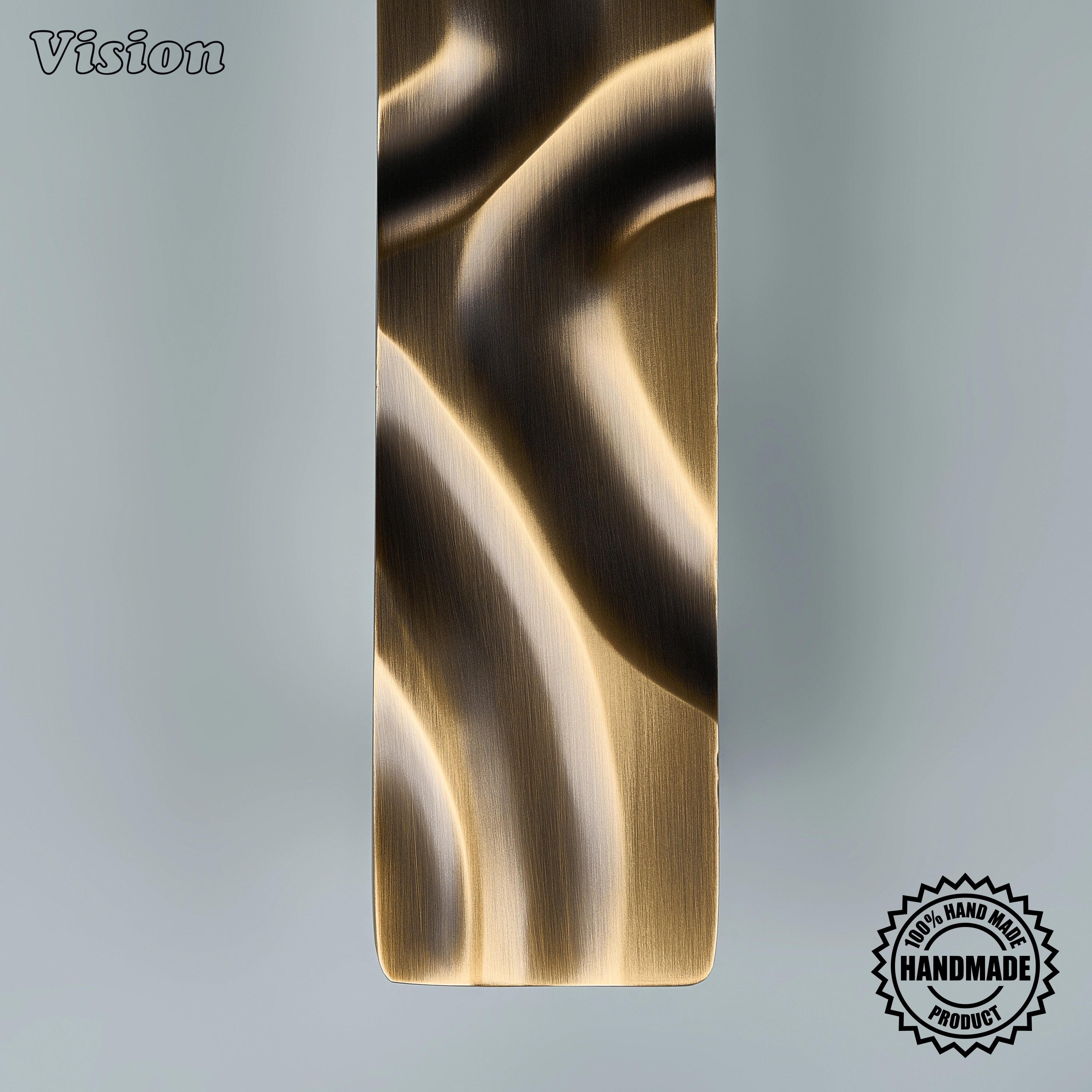Solid brass antique bronze appliance pull with flowing handcrafted relief on entryway doors