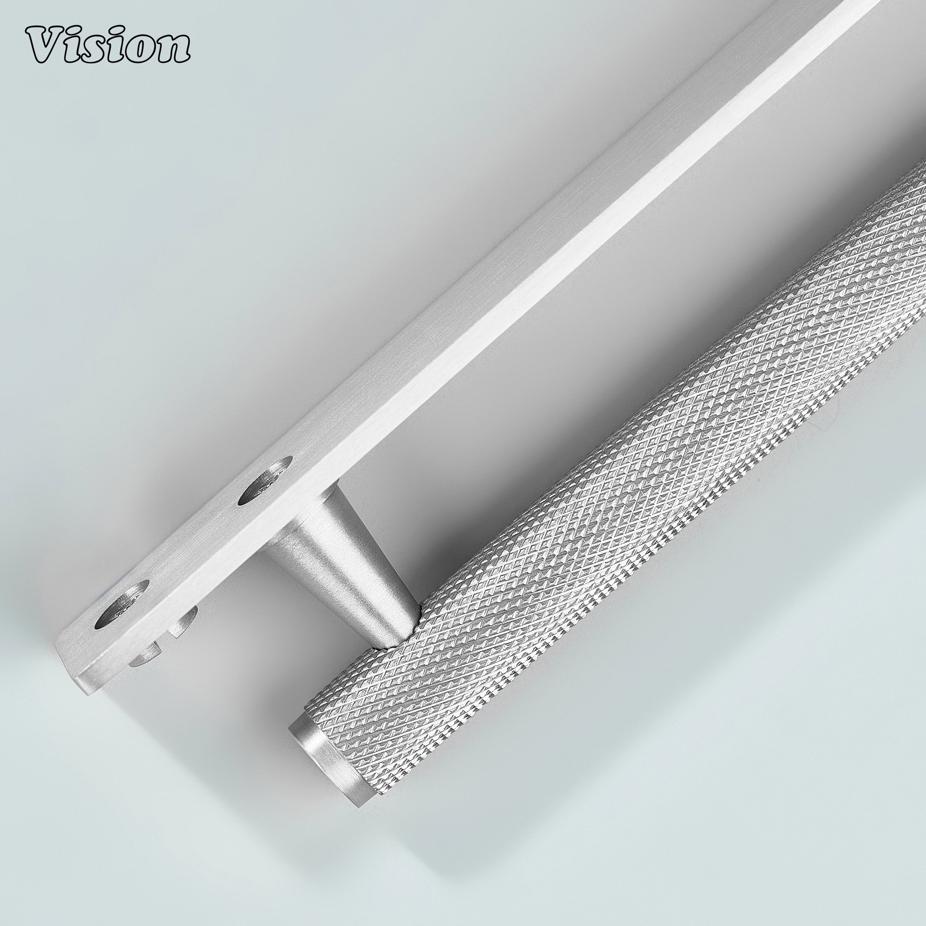 Silver knurled cabinet handle used on wooden drawers