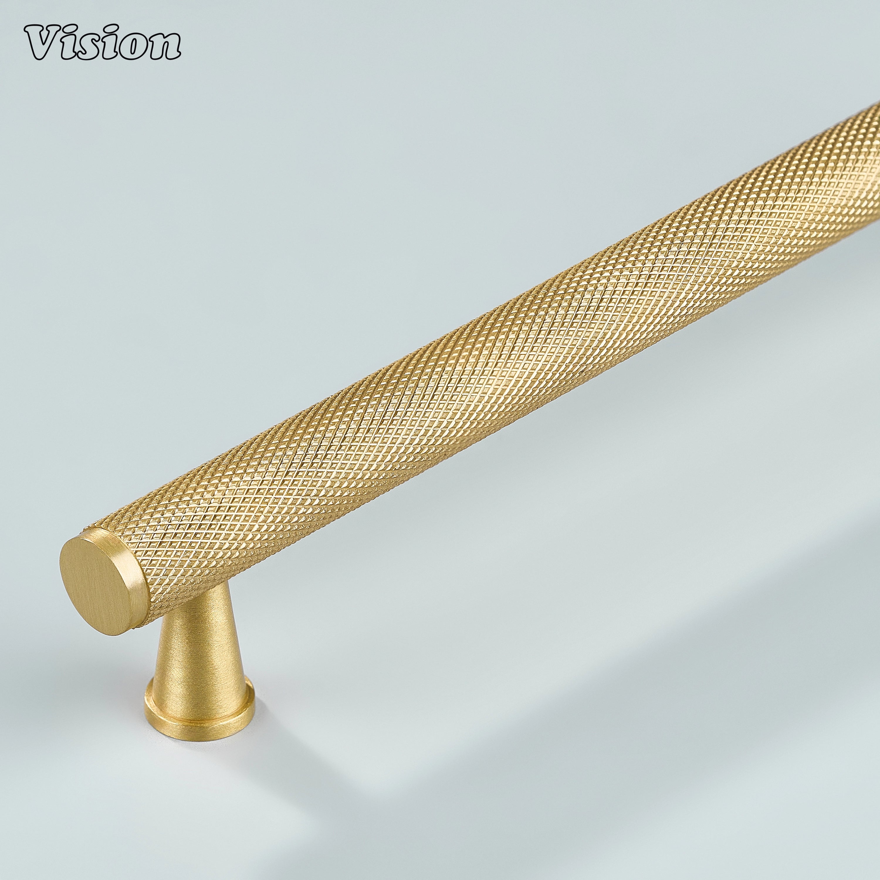 Modern gold knurled cabinet handle with cone legs for kitchen cabinets.