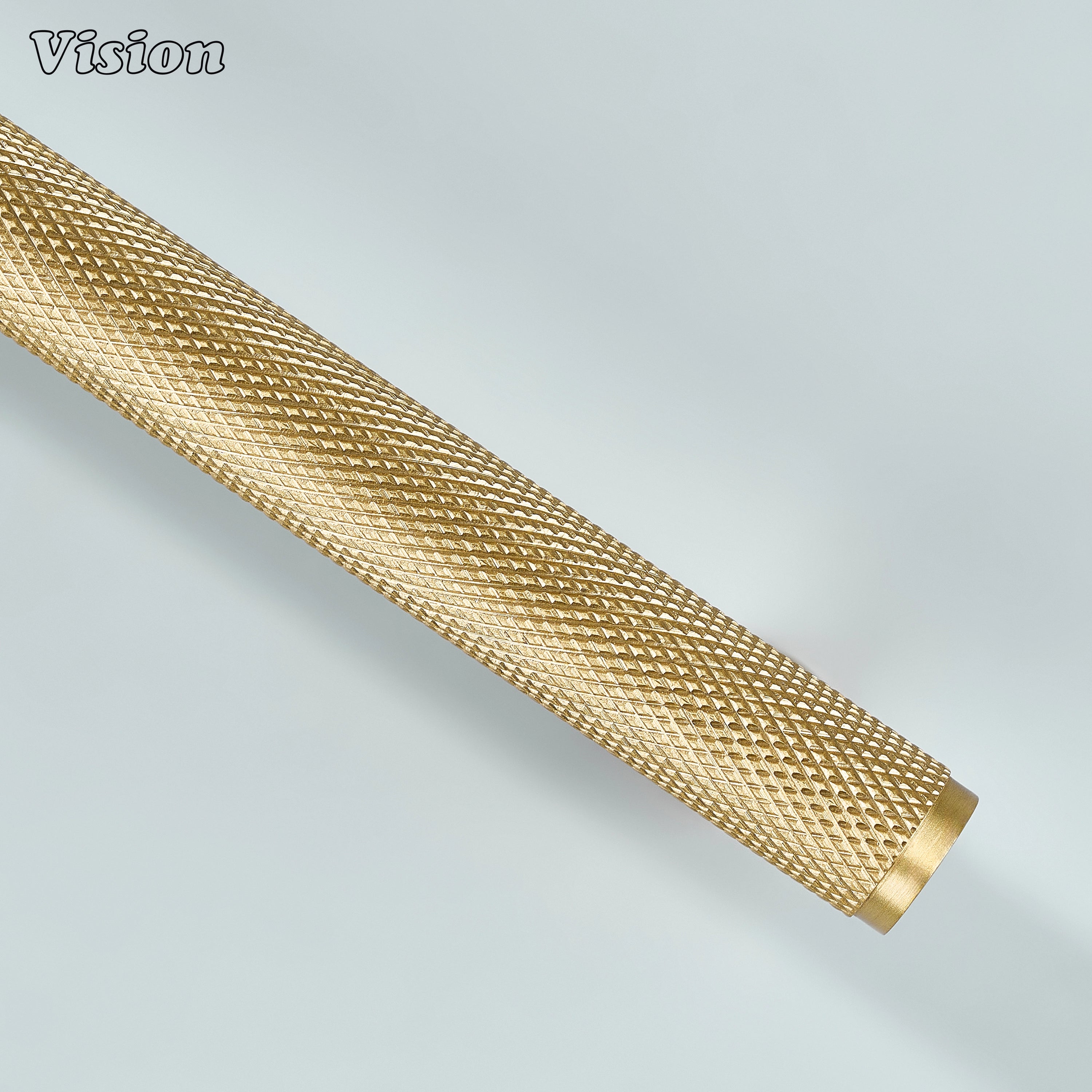 Gold decorative knurled handle used for furniture drawers.