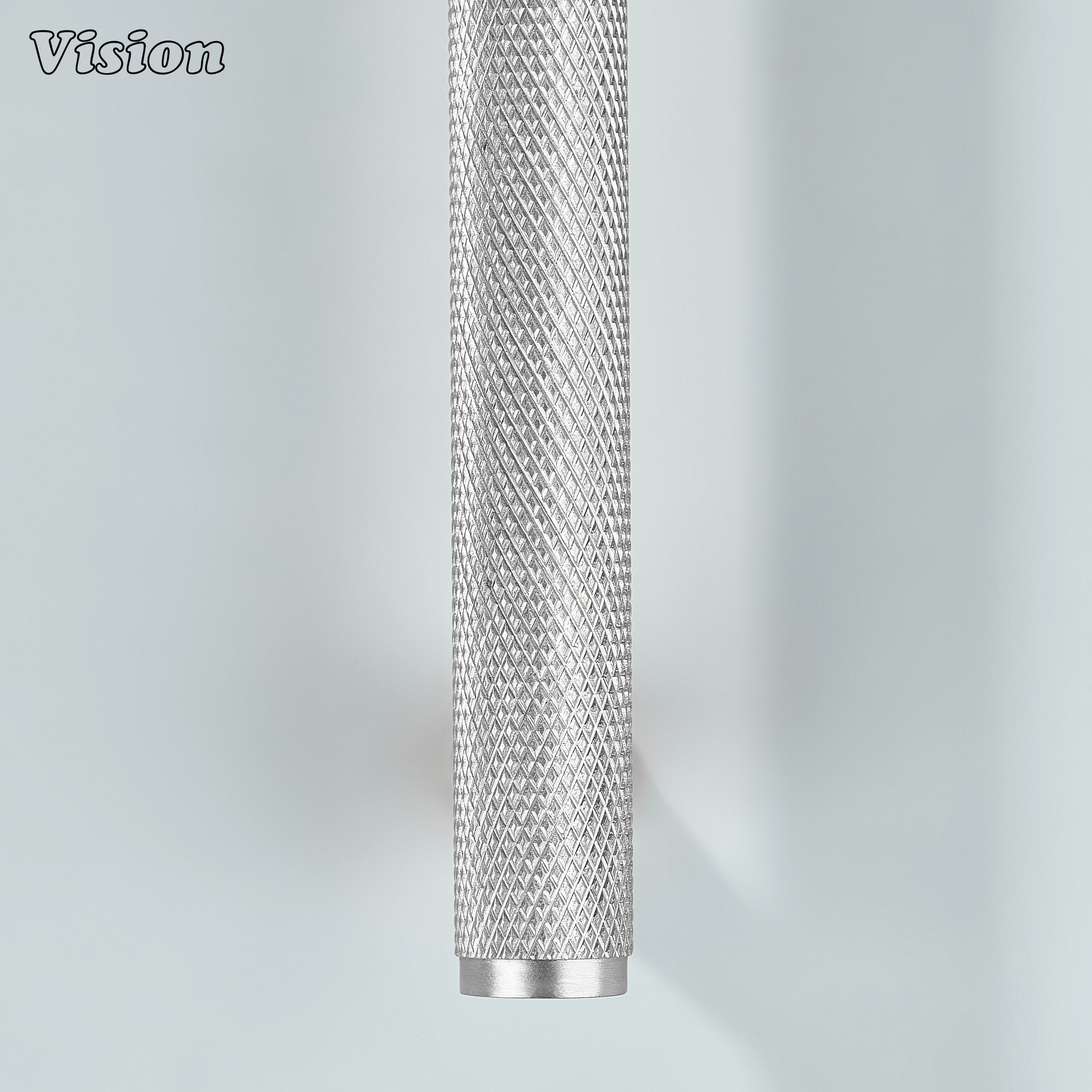 Silver knurled handle for modular kitchen cabinetry.