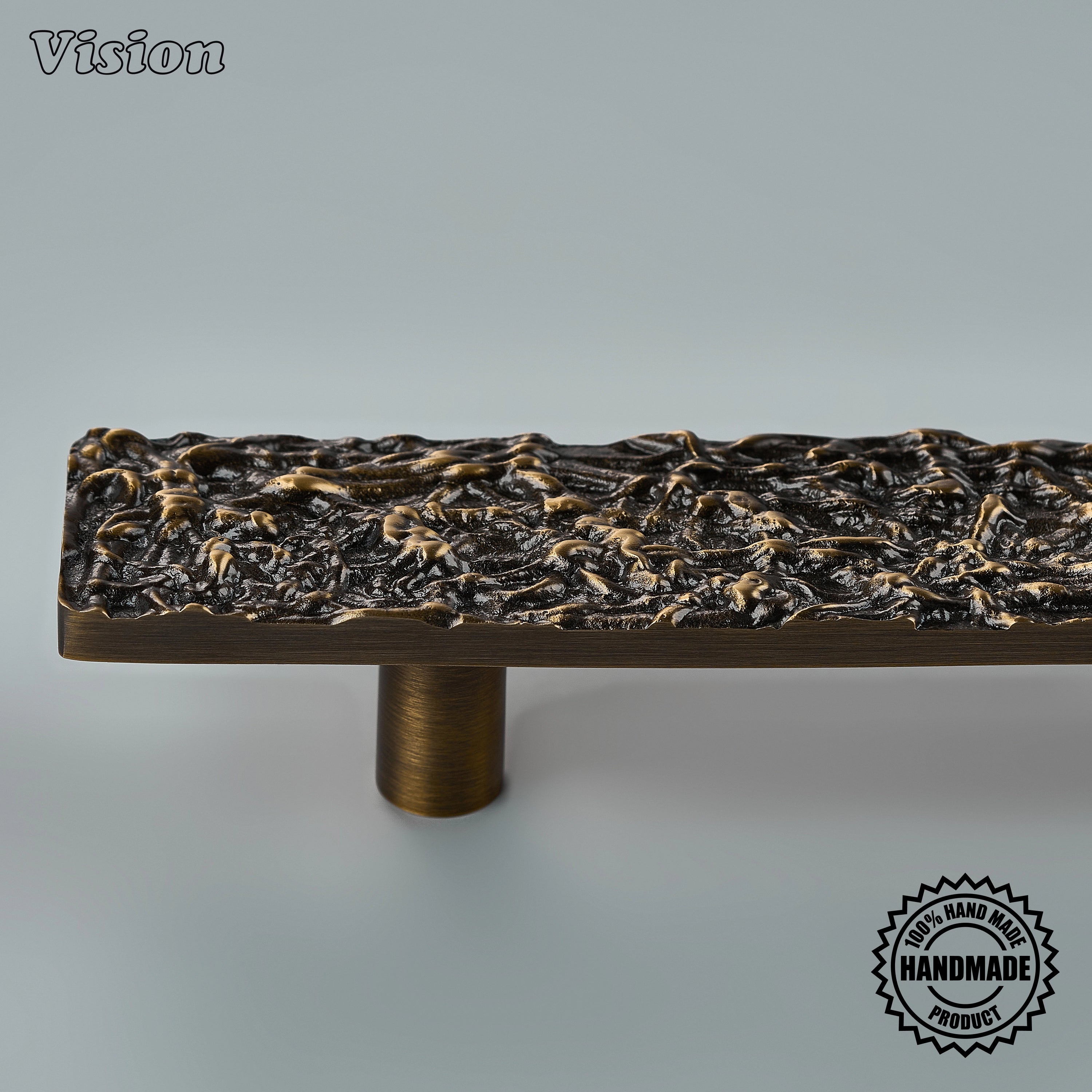 Handcrafted appliance pull in antique bronze finish featuring a textured bar for wardrobes
