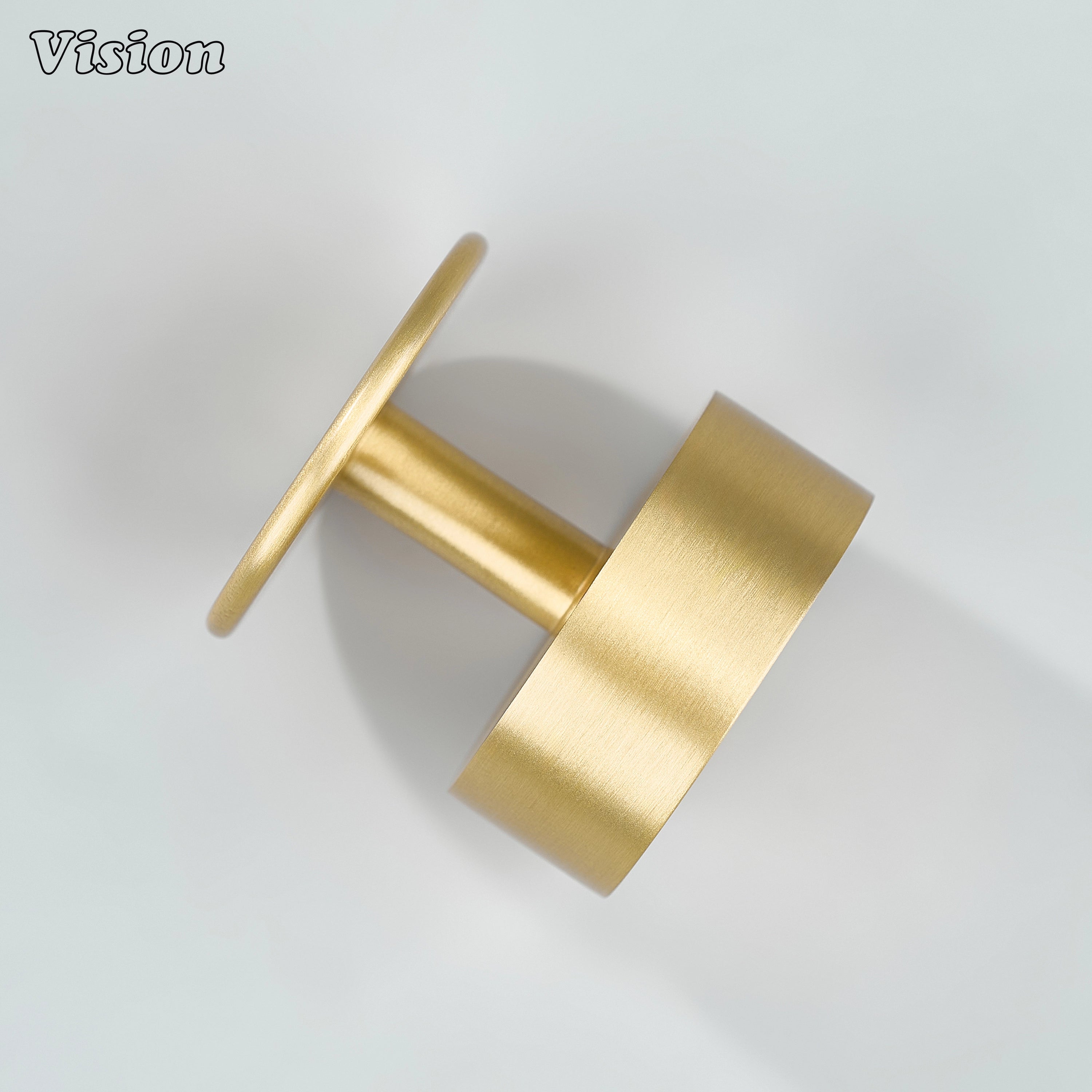 Gold round brass cabinet knob with minimal design for drawers