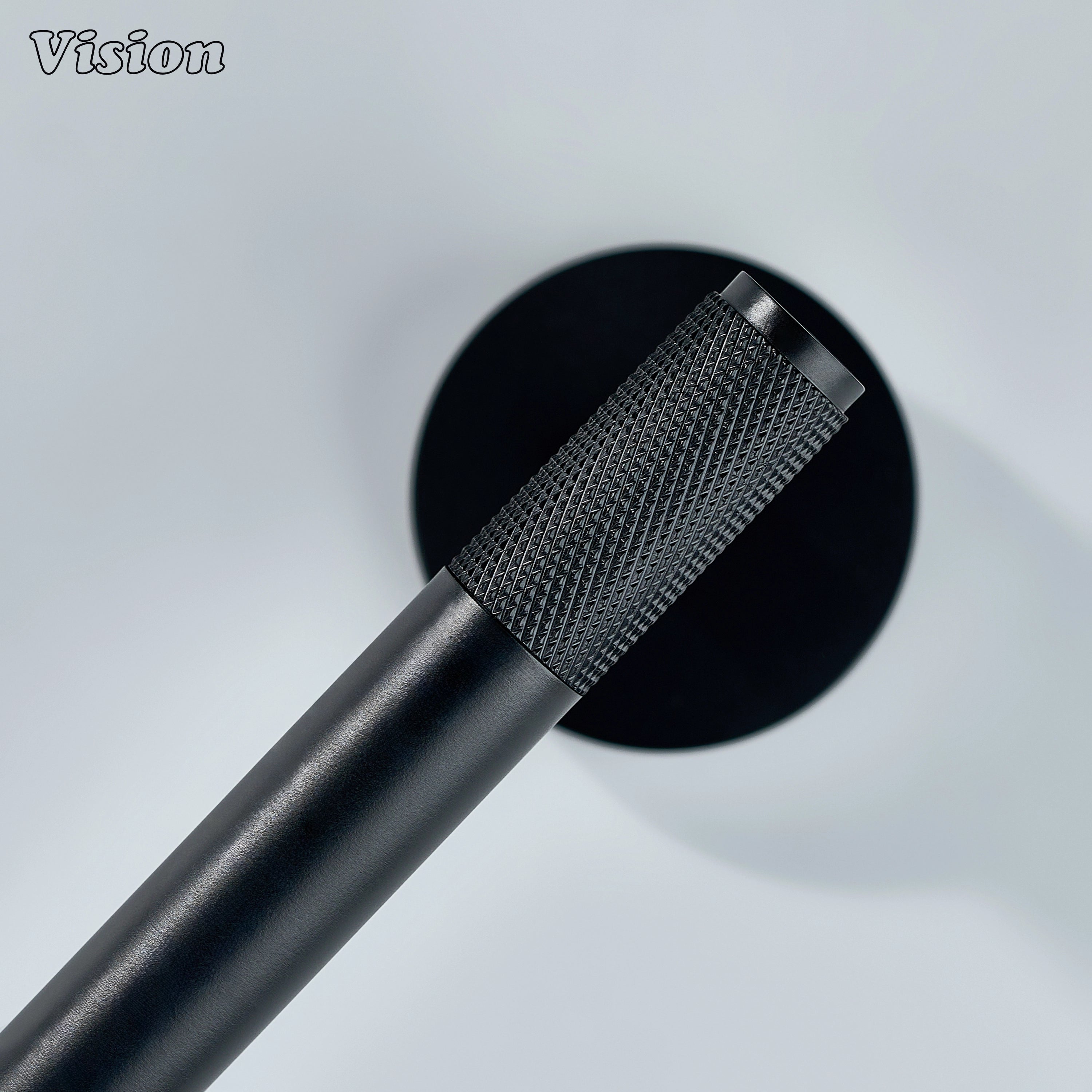 Minimal black brass toilet paper holder with round base