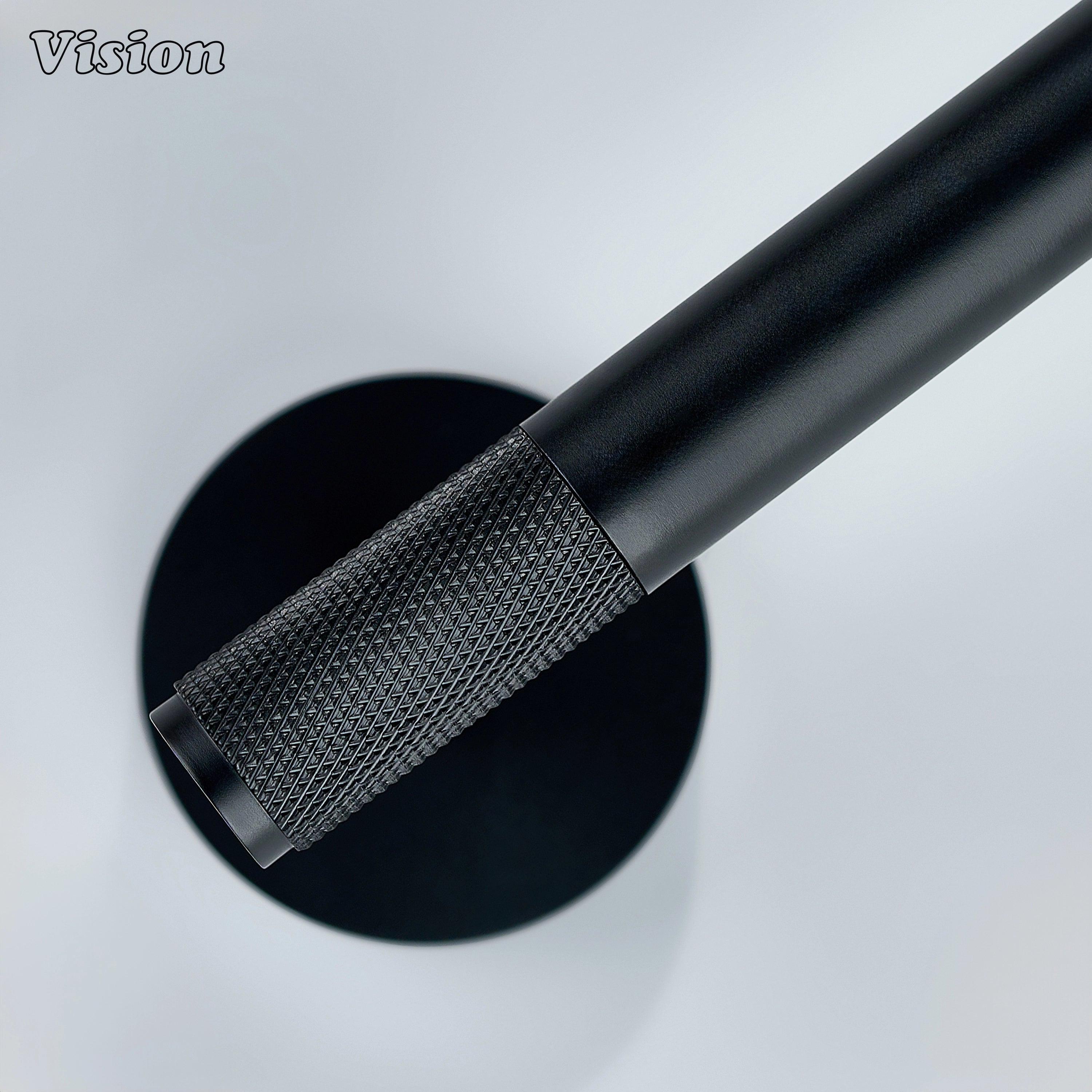 Black brass toilet paper holder with textured bar for bathrooms