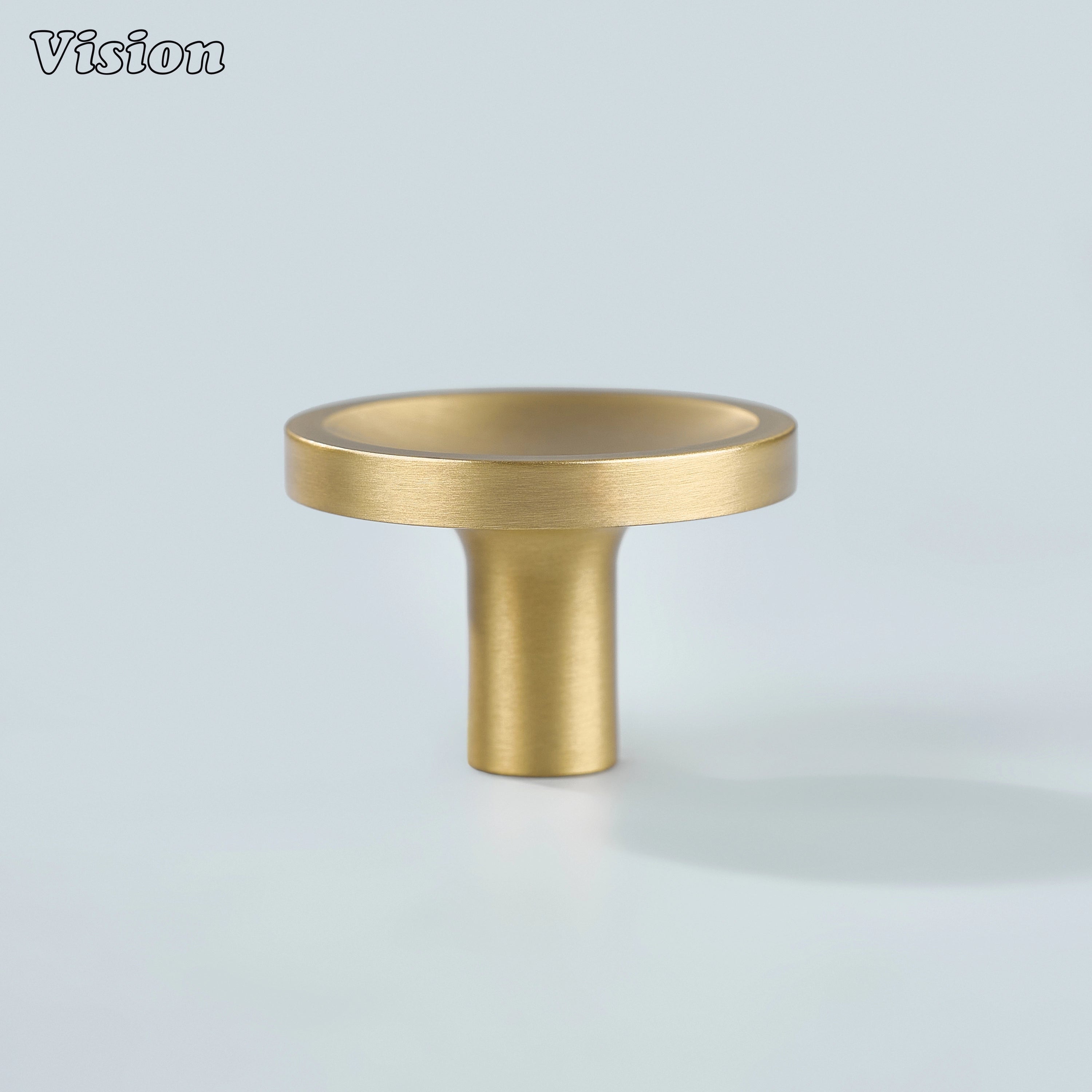Gold plain round cabinet knob featuring dished surface detail for modern wardrobe doors