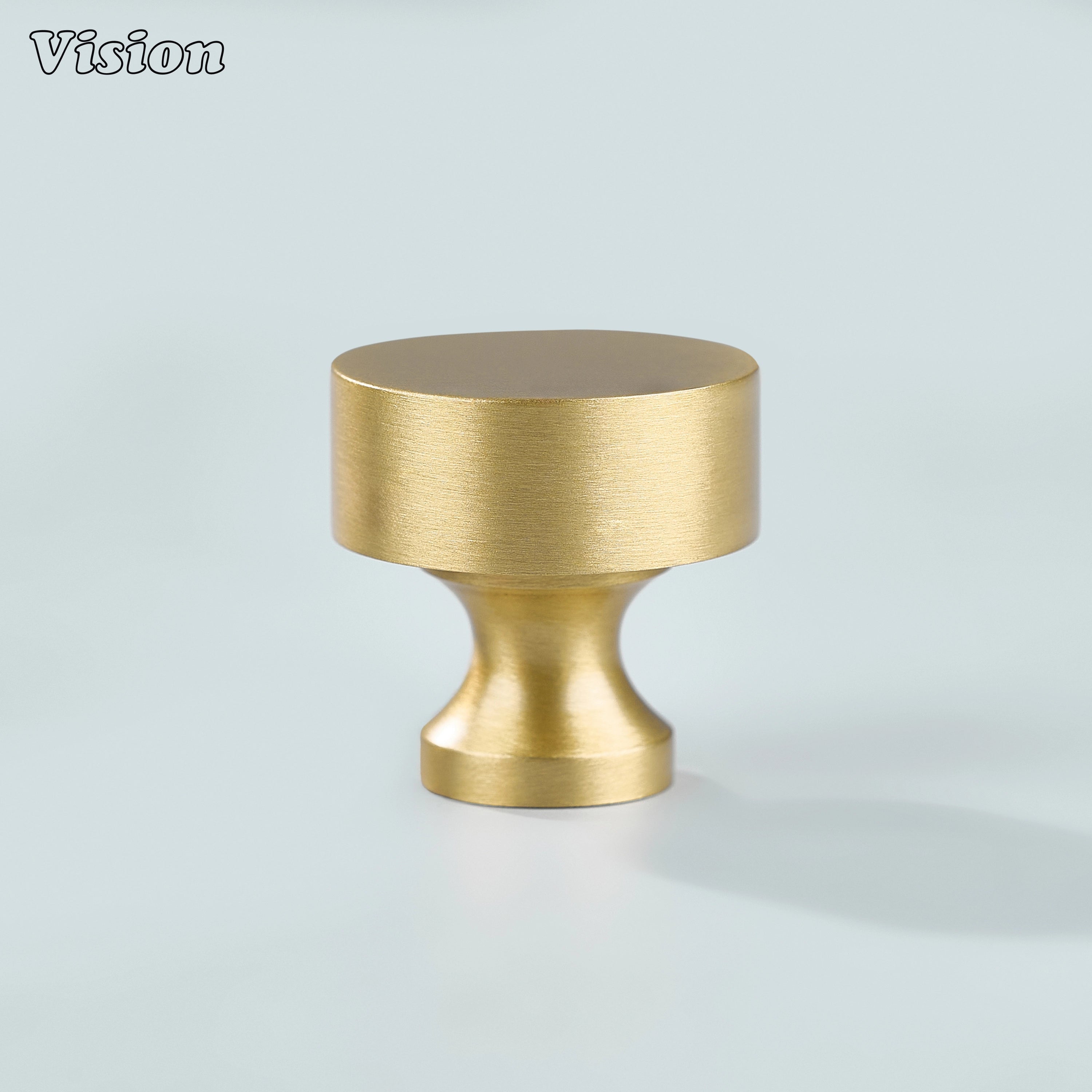 Round plain gold brass cabinet knob installed on modern kitchen cabinets