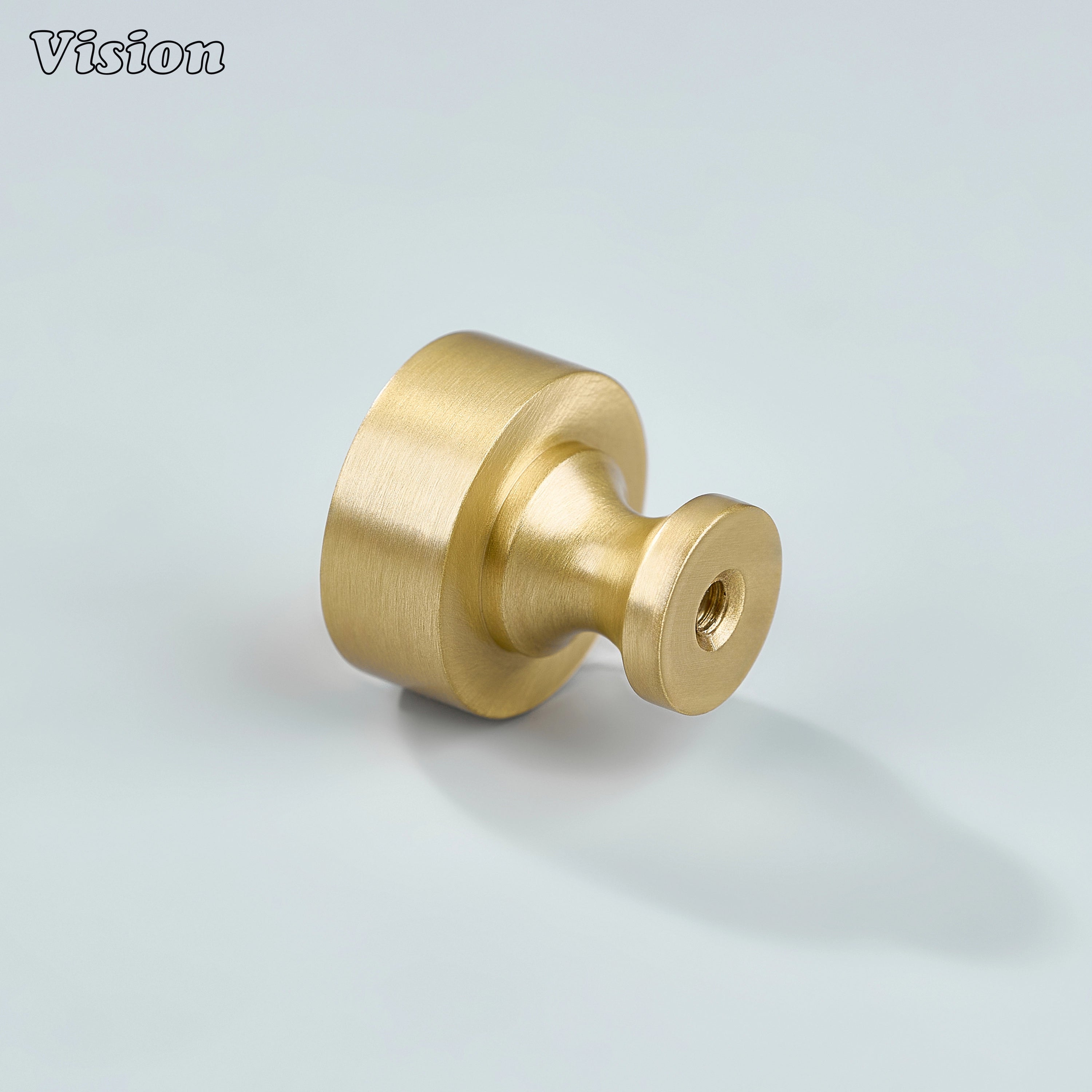 Small round gold cabinet knob with smooth profile for wardrobe doors