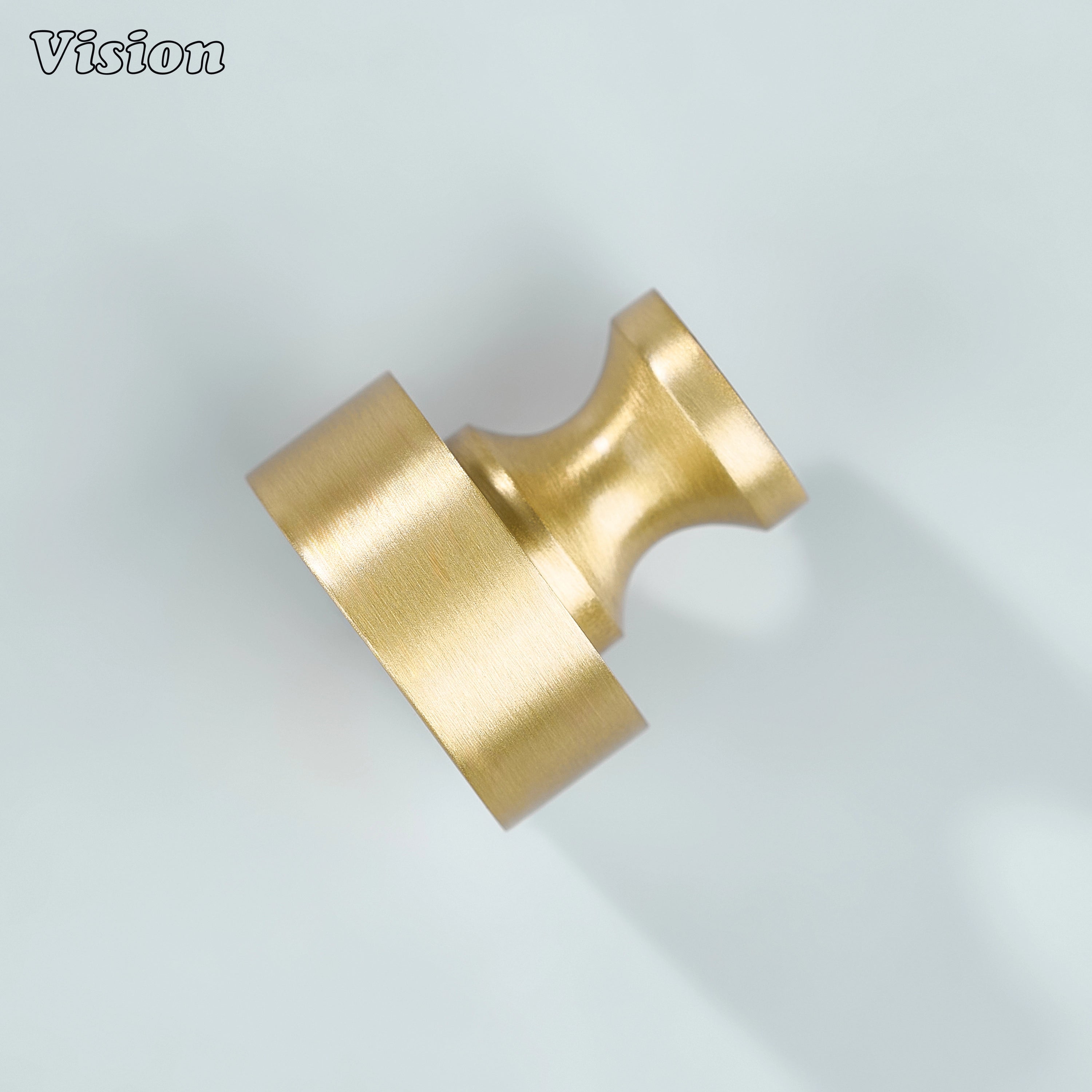Gold finished round cabinet knob for minimalist kitchen cabinetry