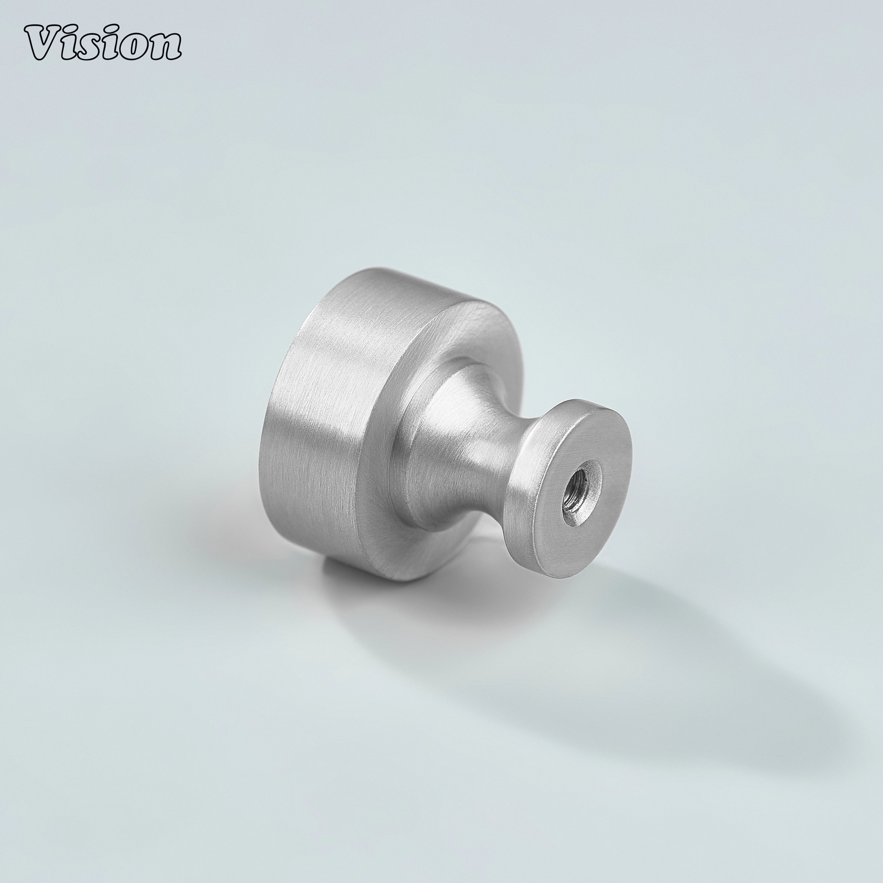 Small round Silver cabinet knob installed on wardrobe panels