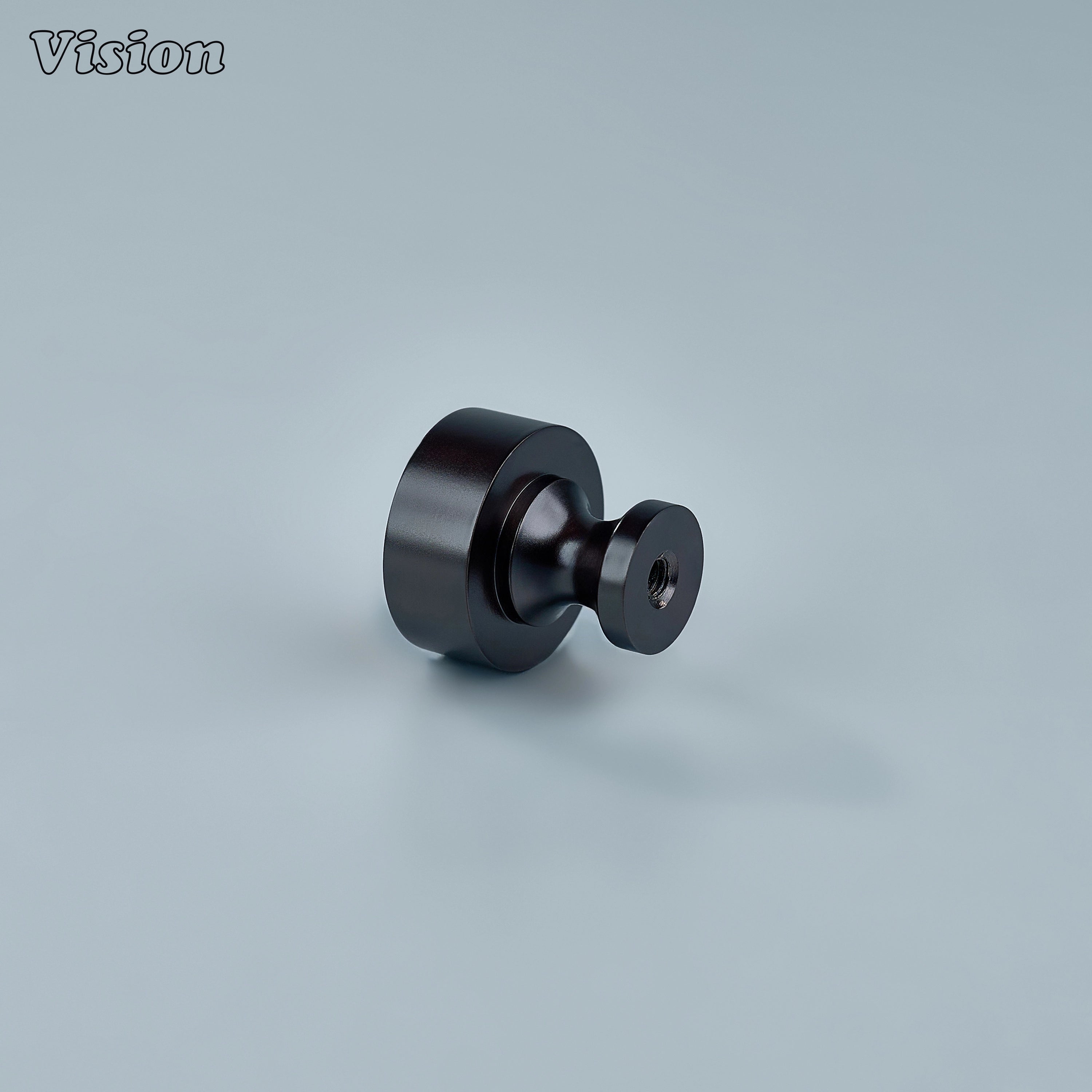Small round Oil Rubbed Bronze cabinet knob used on wardrobe doors