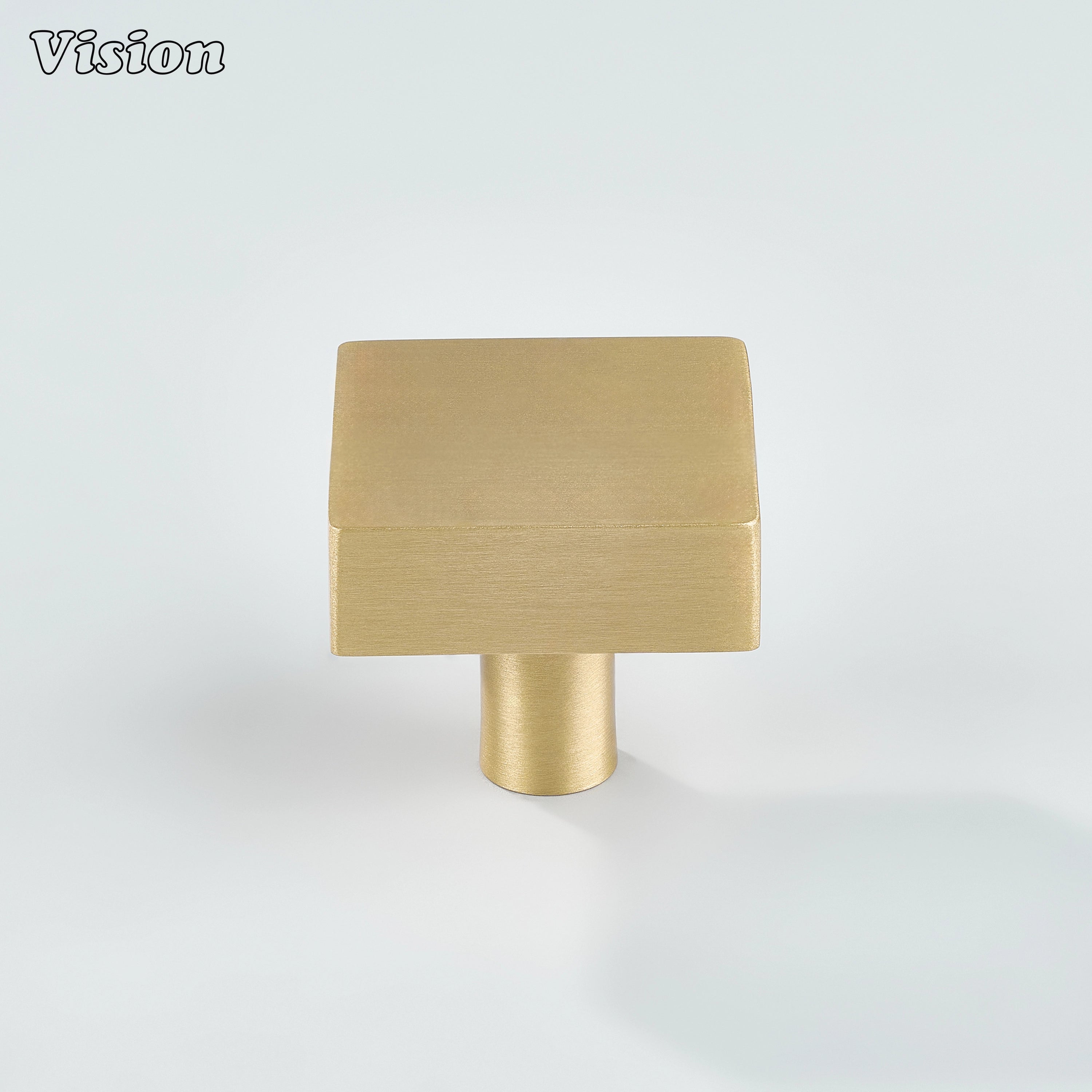 Gold brass square cabinet knob with smooth top surface for minimalist drawer fronts
