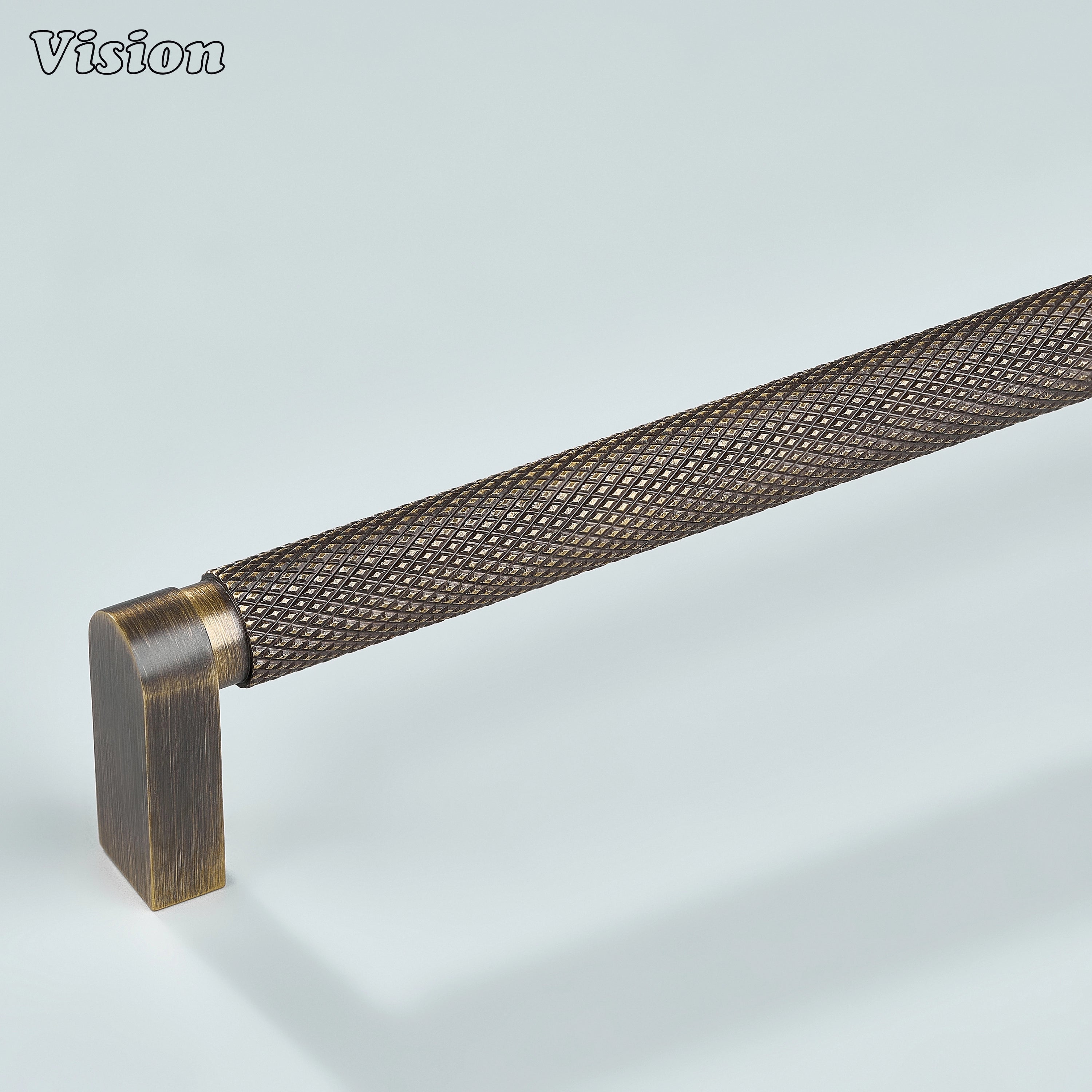 Antique bronze ripple knurled cabinet handle installed on kitchen cabinets.