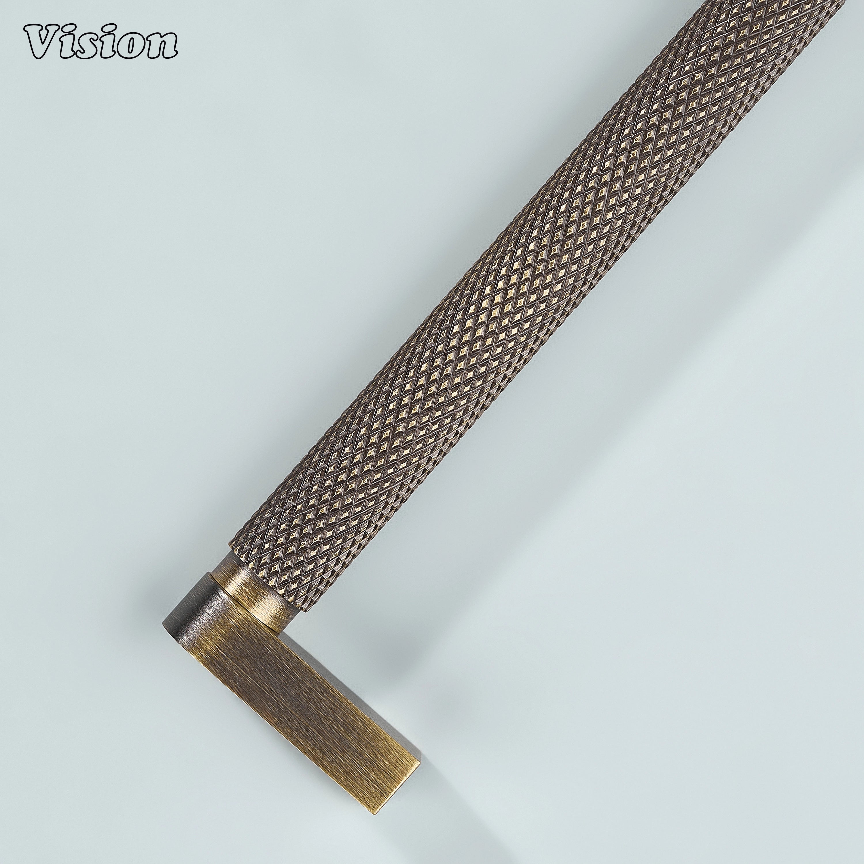 Antique bronze ripple knurled cabinet handle installed on vanity drawers.