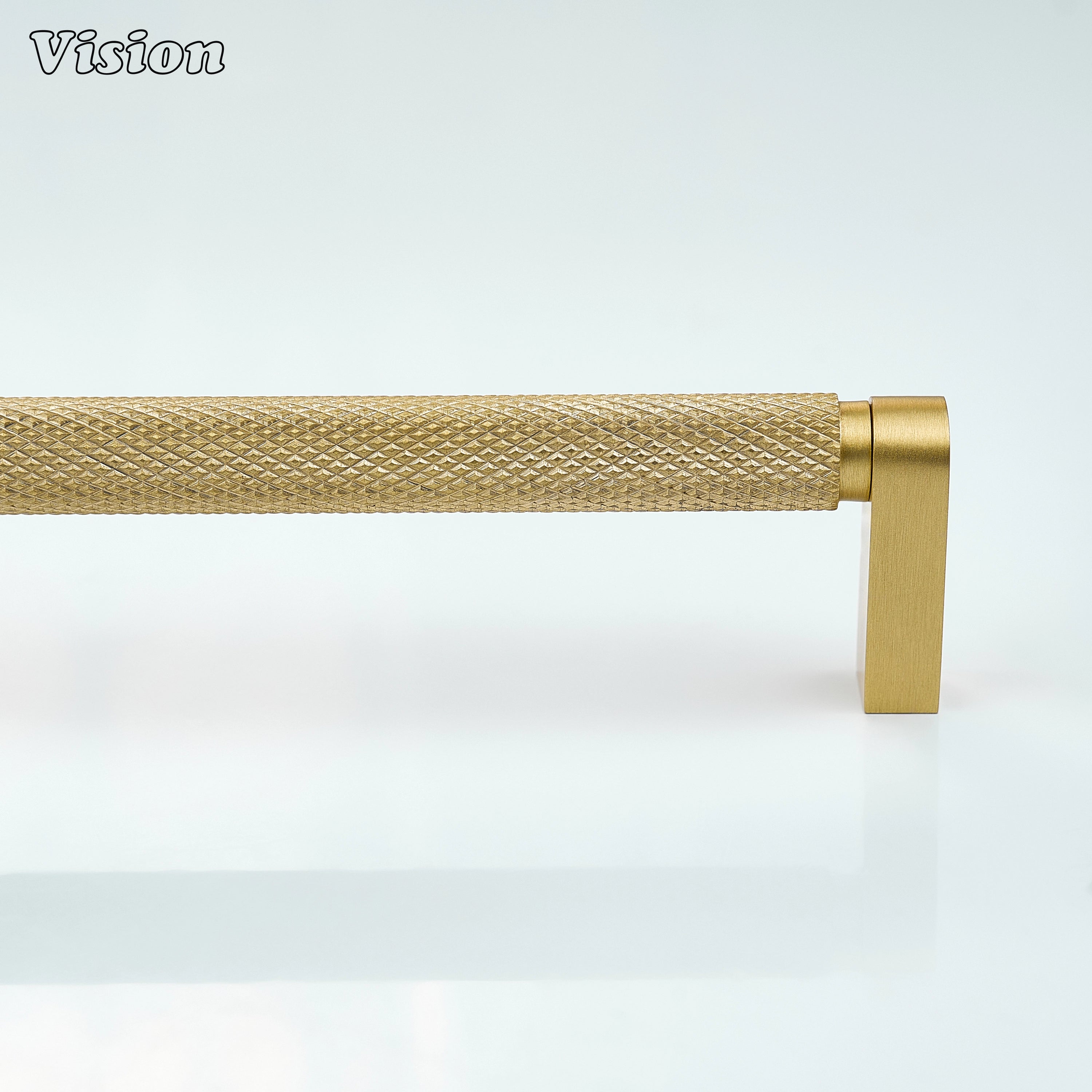 Gold ripple knurled cabinet handle used on bathroom cabinets.
