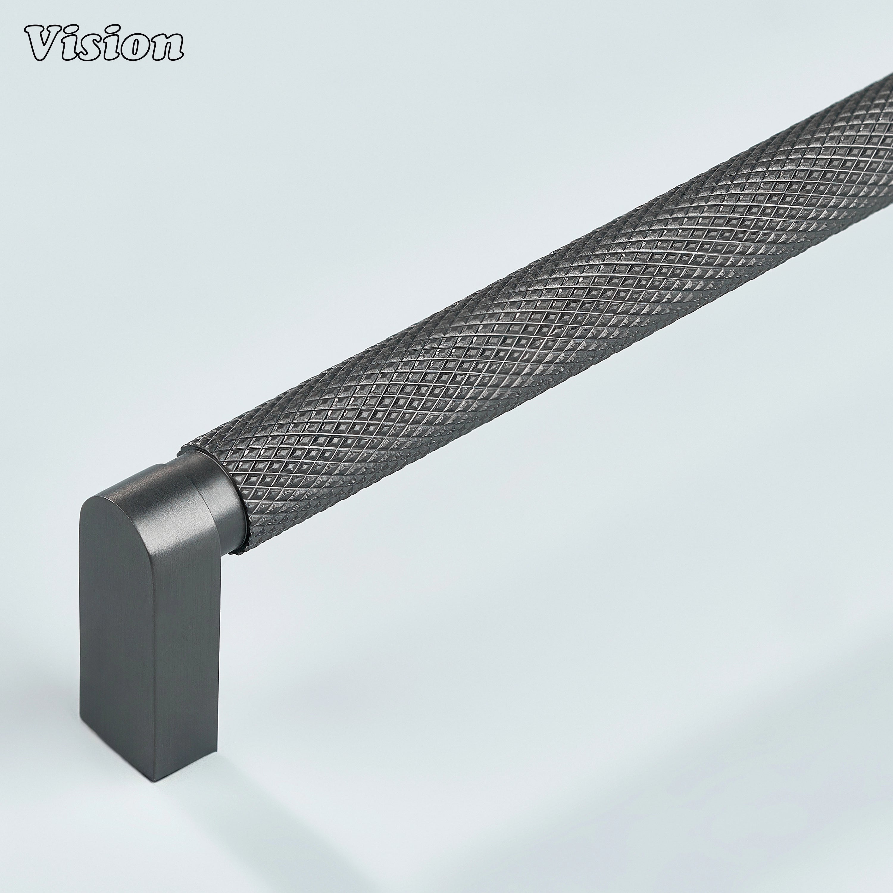 Gunmetal ripple knurled cabinet handle installed on kitchen cabinets.