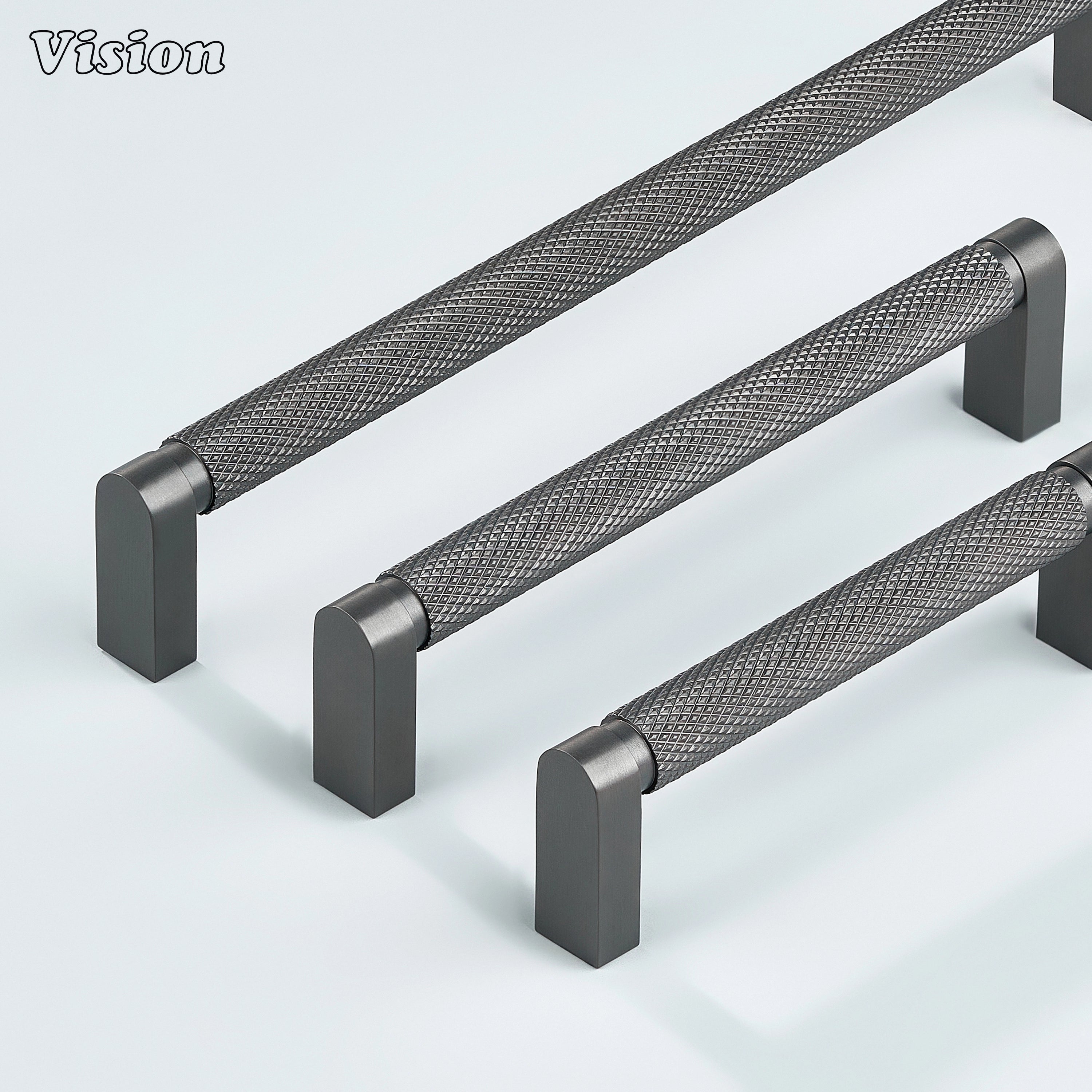 Gunmetal ripple knurled cabinet handle mounted on dresser drawers.