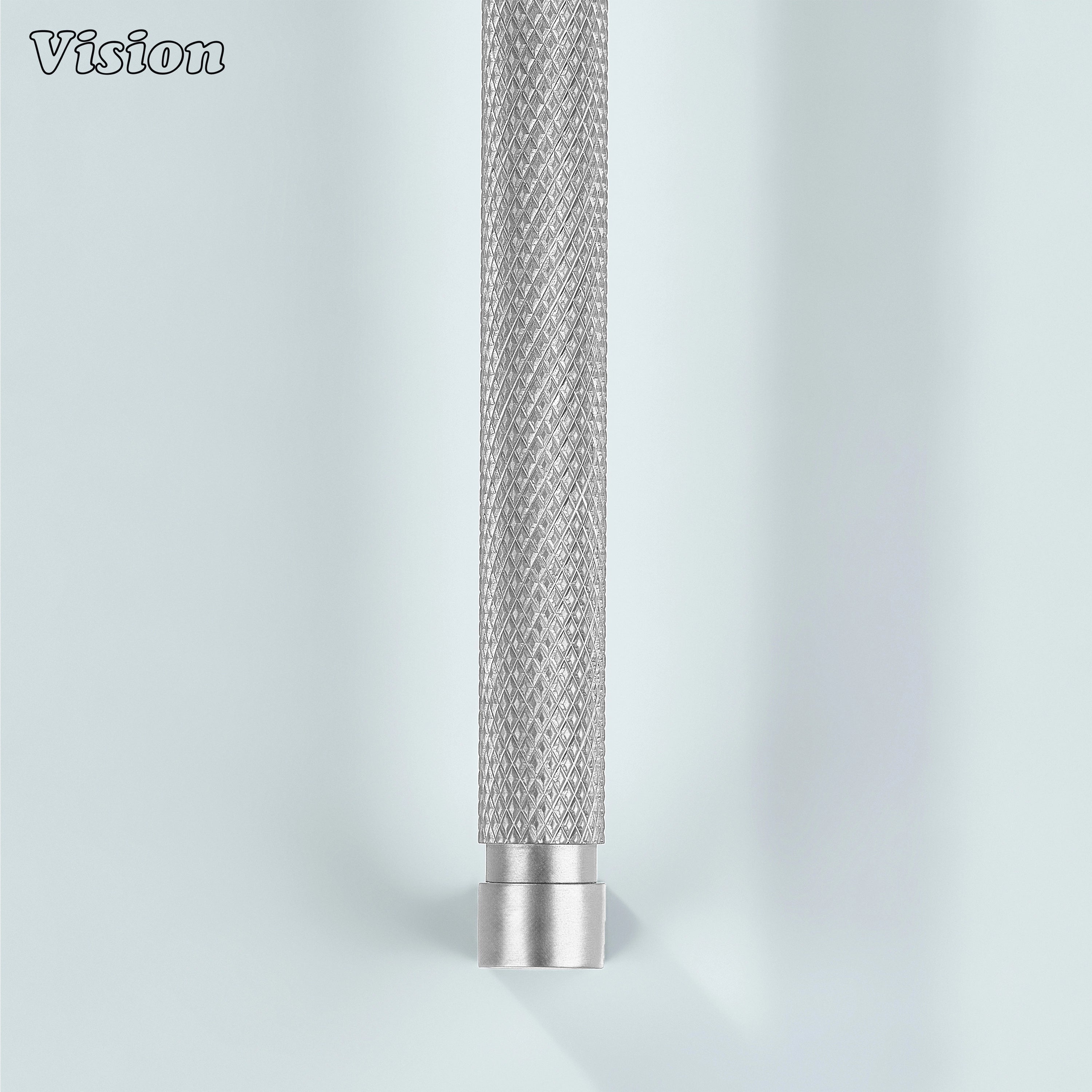 Silver ripple knurled cabinet handle used on modular kitchen cabinets.