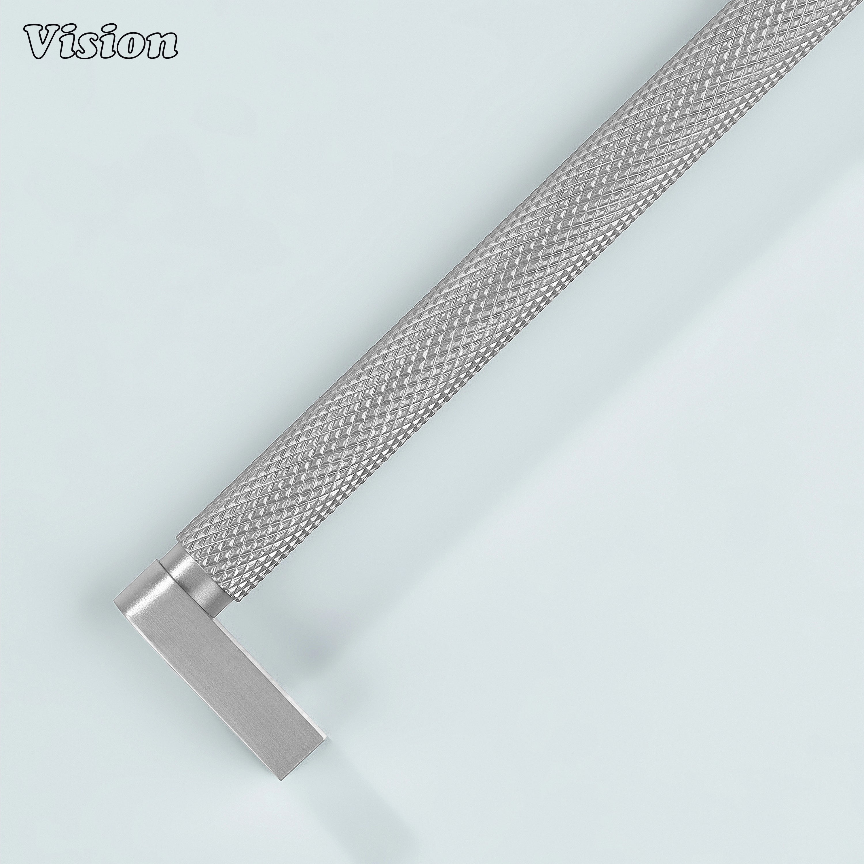 Silver ripple knurled cabinet handle installed on vanity drawers.