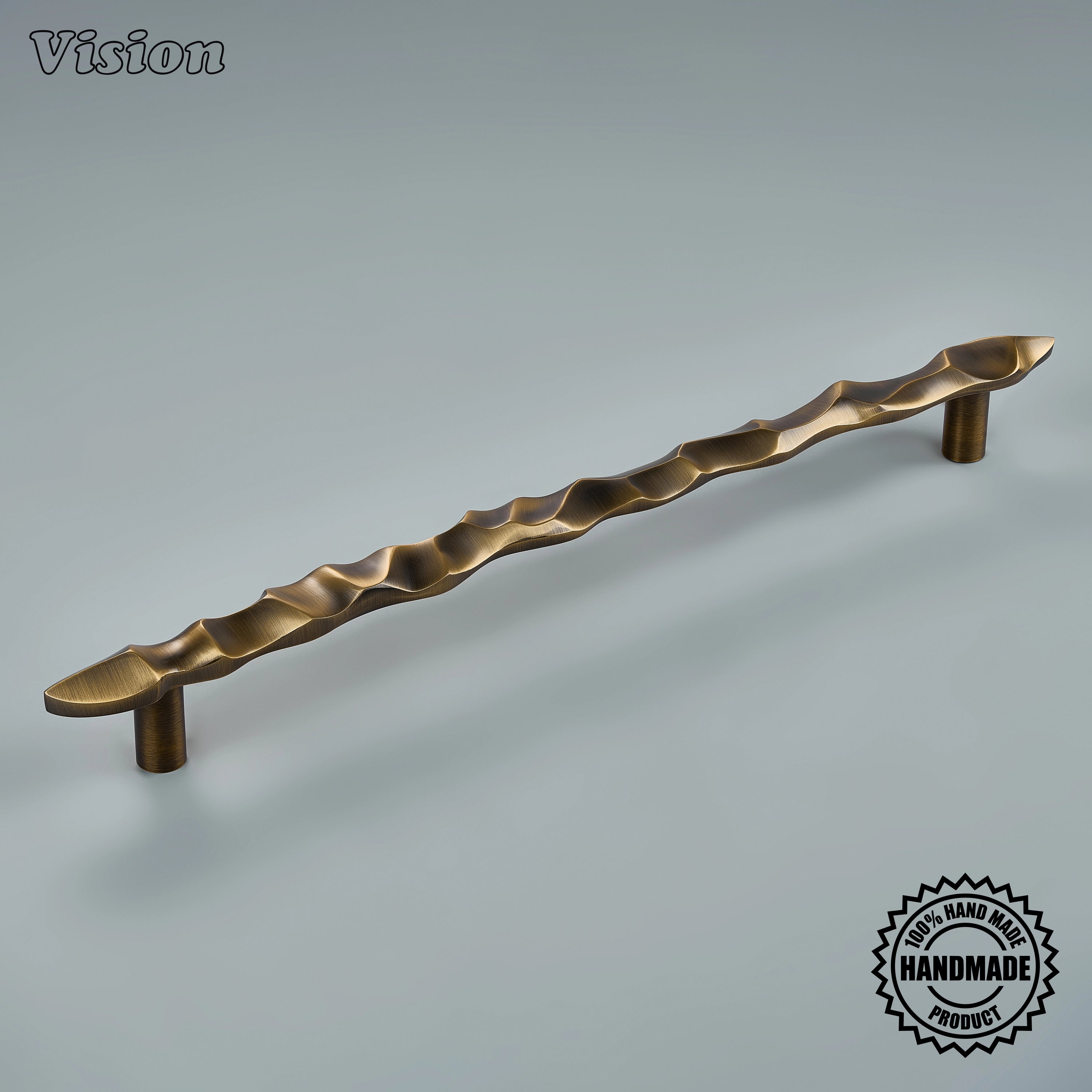 Antique Bronze handcrafted appliance pull with sculpted undulating texture on tall pantry doors