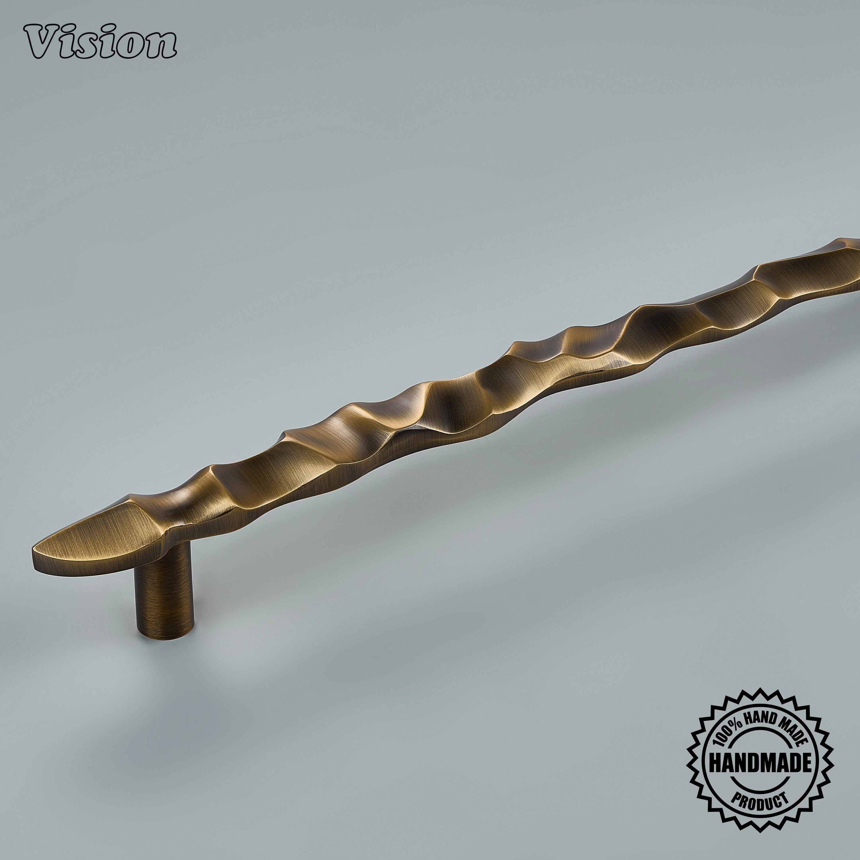 Sculpted antique bronze door handle with organic wave ridges on panel-ready refrigerator panels