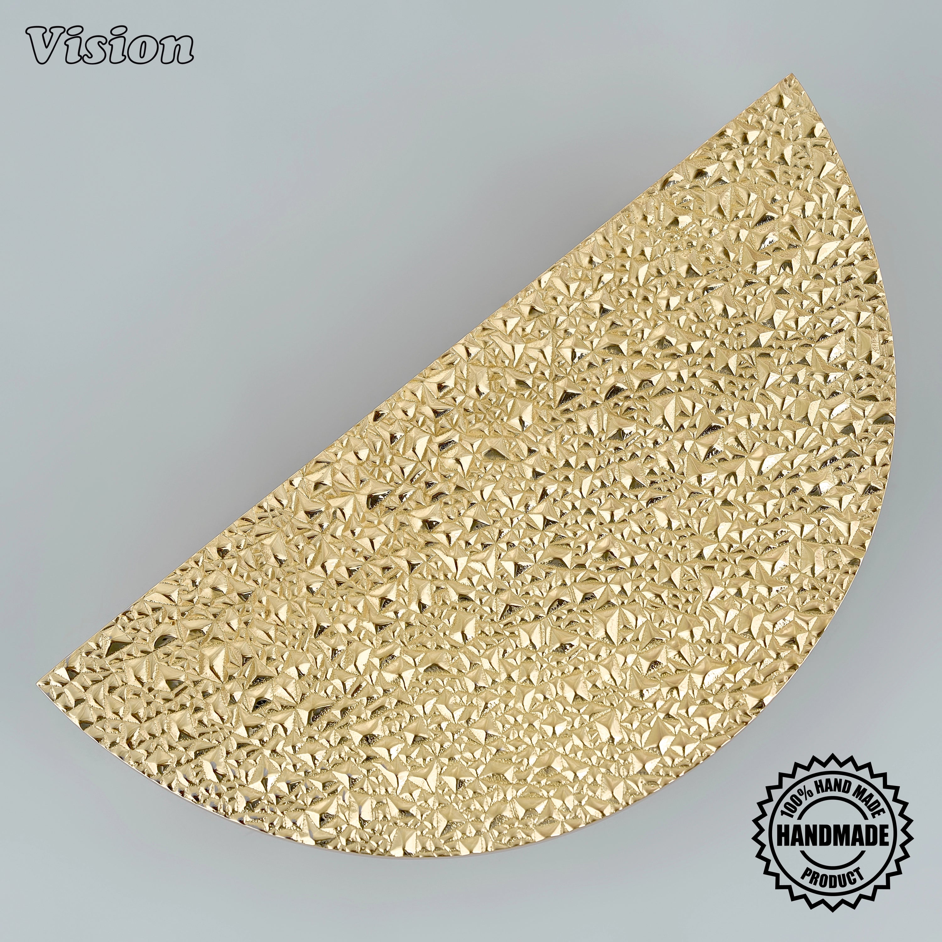 Luxury polished brass sculpted door handle with half-round shape on oversized architectural entryways