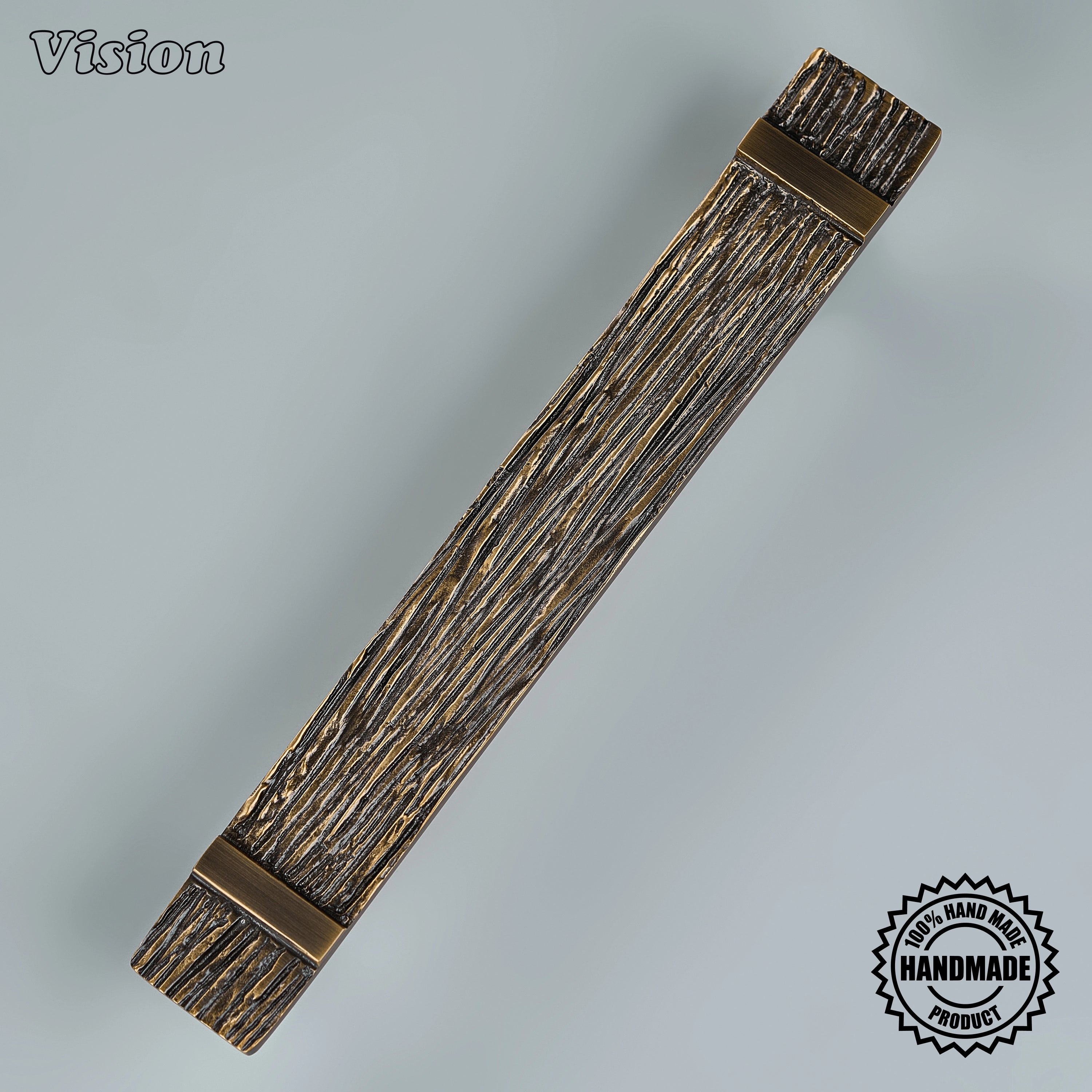 Luxury antique bronze sculpted appliance pull with round base legs on custom built-in freezers