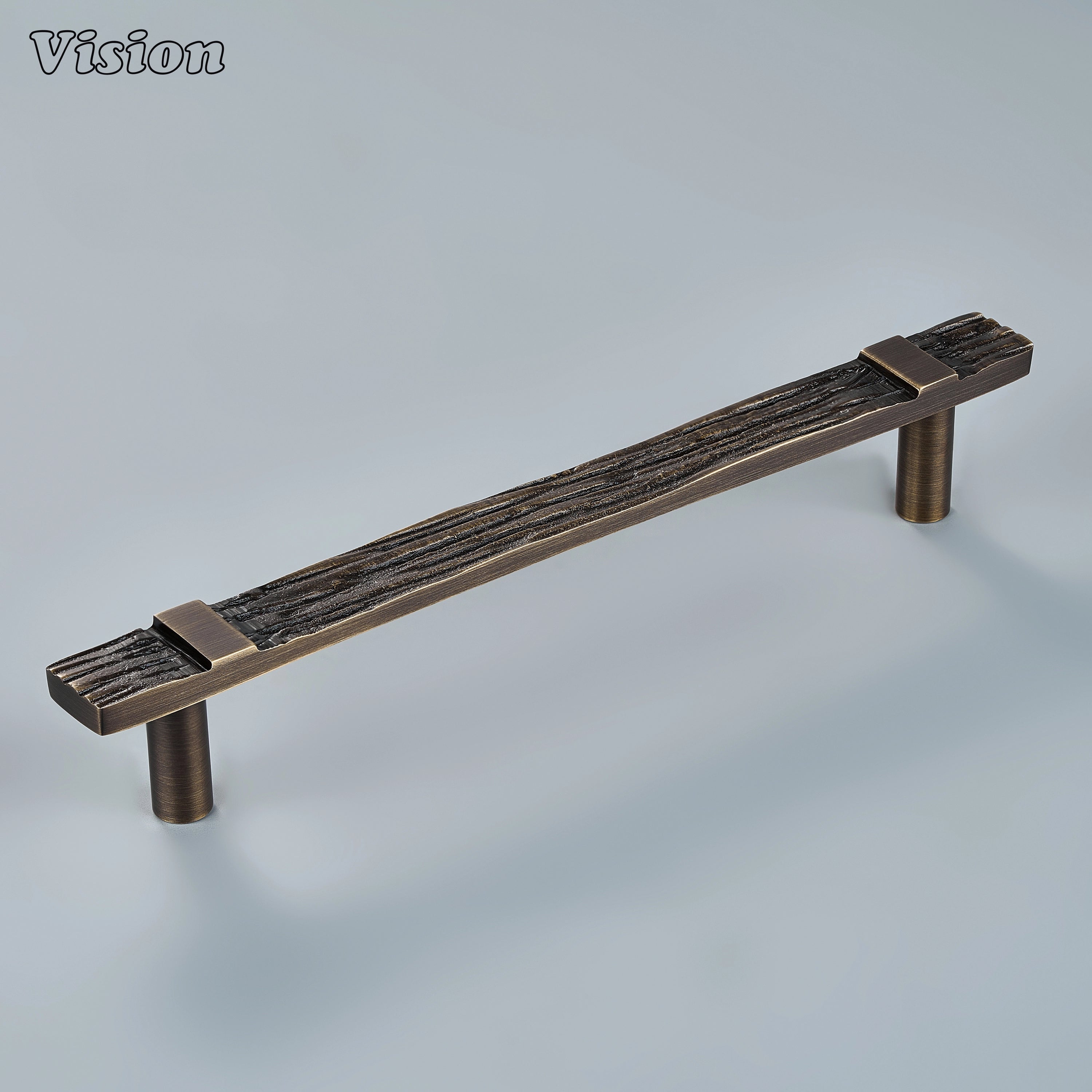 Sculpted antique bronze cabinet handle with ancient artifact relief on modern statement drawers
